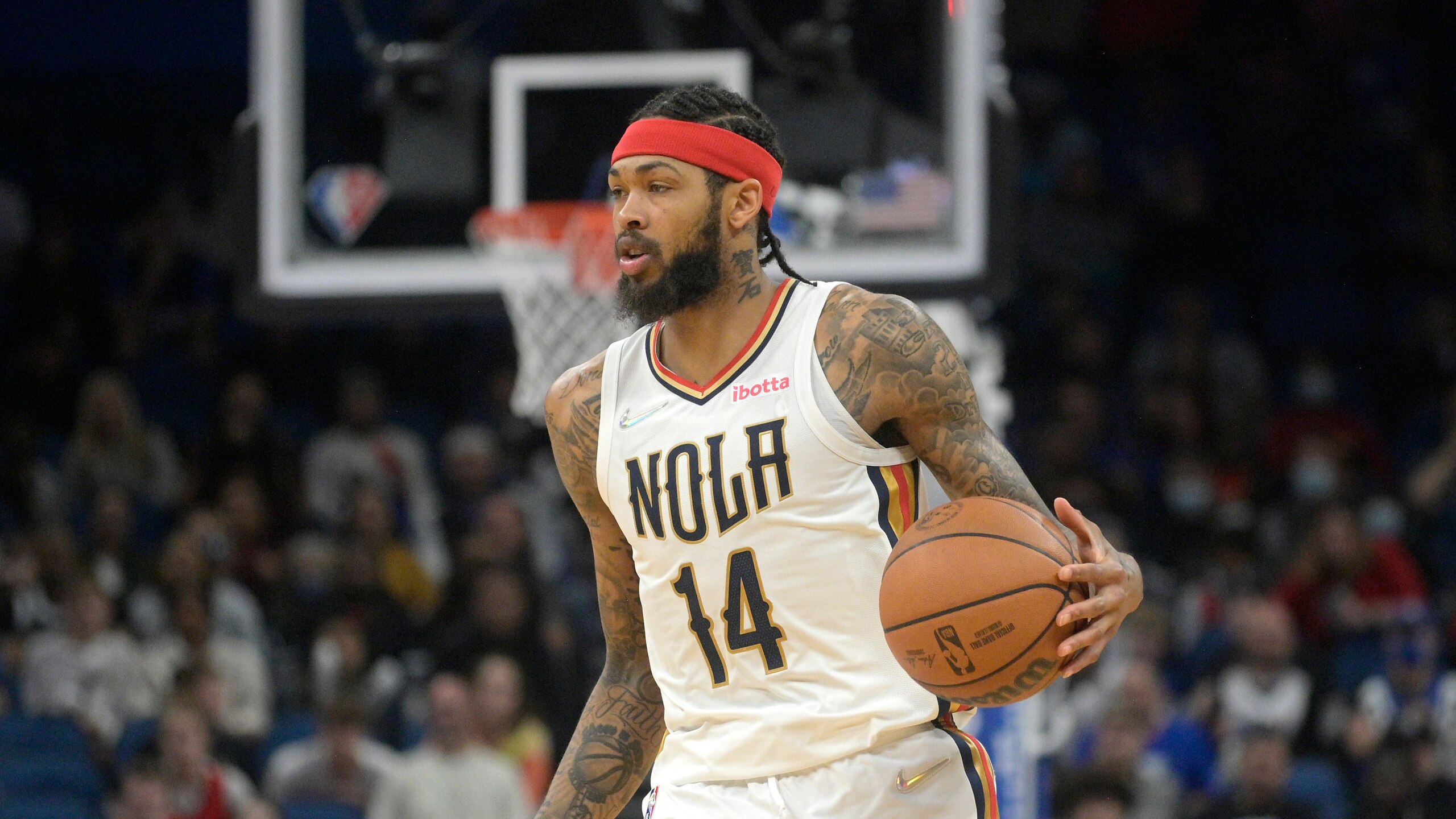 New Orleans Pelicans forward Brandon Ingram (14) sets up a play during the second half of an NBA basketball game against the Orlando Magic, Thursday, Dec. 23, 2021, in Orlando, Fla. (AP Photo/Phelan M. Ebenhack)