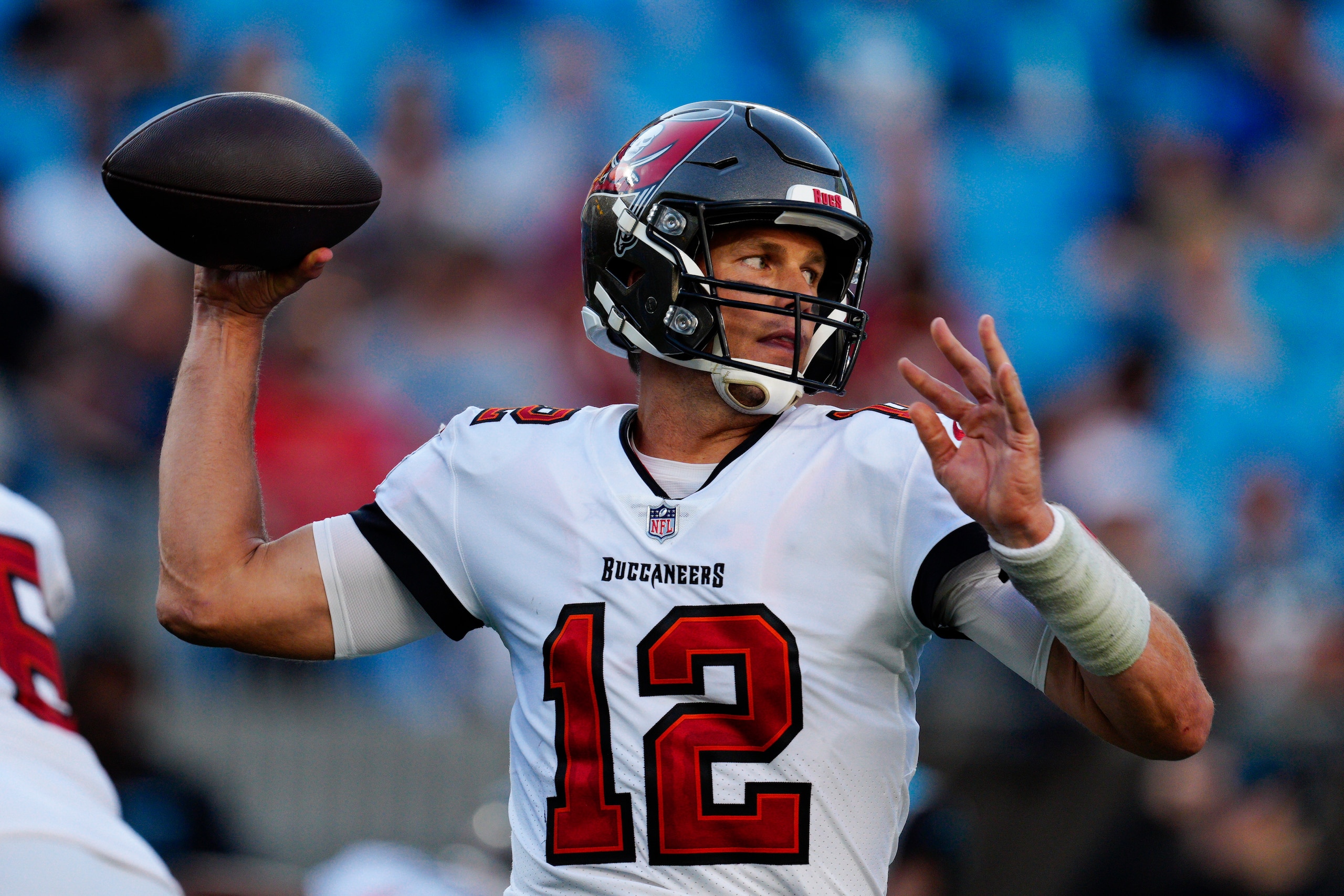 Tampa Bay Buccaneers quarterback Tom Brady passes against the Carolina Panthers during the second half of an NFL football game Sunday, Dec. 26, 2021, in Charlotte, N.C. (AP Photo/Jacob Kupferman)