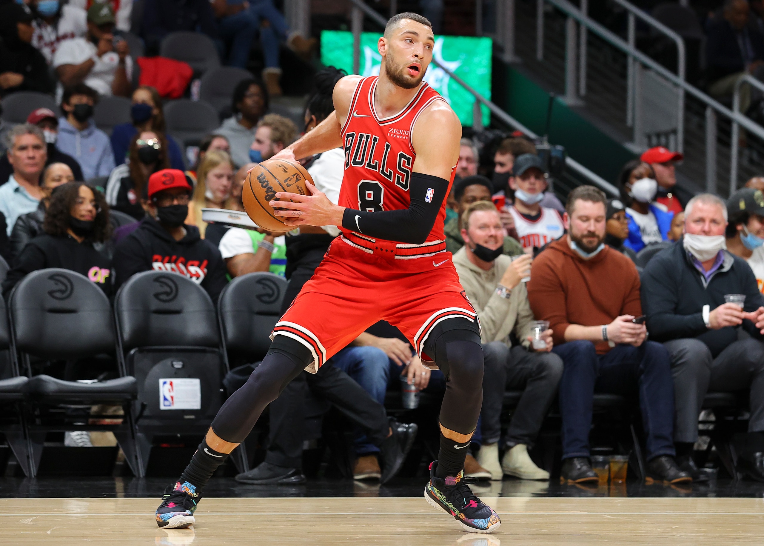 ATLANTA, GA - DECEMBER 27: Zach LaVine #8 of the Chicago Bulls rebounds and heads up court during the first half against the Atlanta Hawks at State Farm Arena on December 27, 2021 in Atlanta, Georgia. NOTE TO USER: User expressly acknowledges and agrees that, by downloading and or using this photograph, User is consenting to the terms and conditions of the Getty Images License Agreement. (Photo by Todd Kirkland/Getty Images)