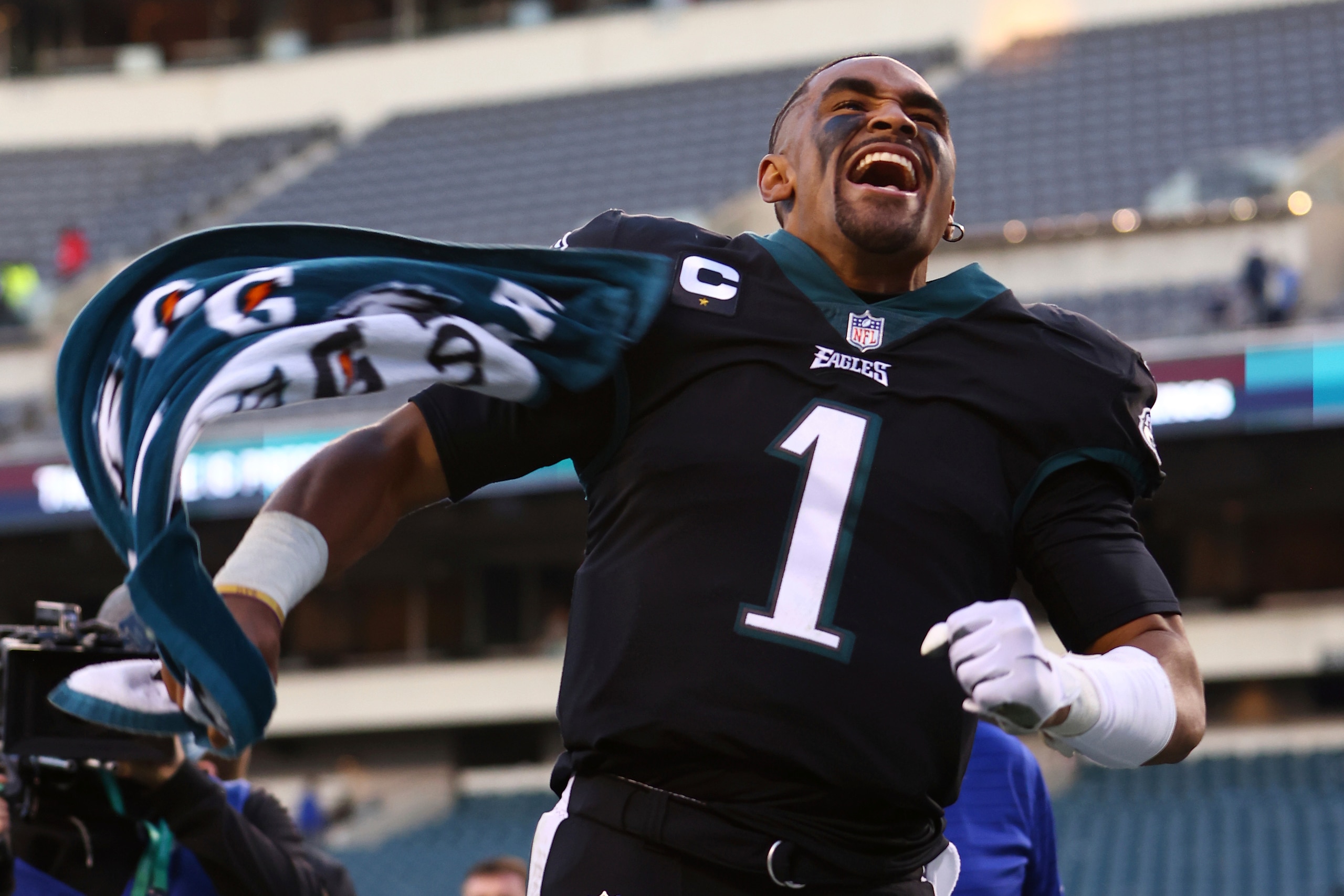 Philadelphia Eagles quarterback Jalen Hurts (1) runs off the field after defeating the New York Giants 34-10 during an NFL football game Sunday, Dec. 26, 2021, in Philadelphia. (AP Photo/Rich Schultz)