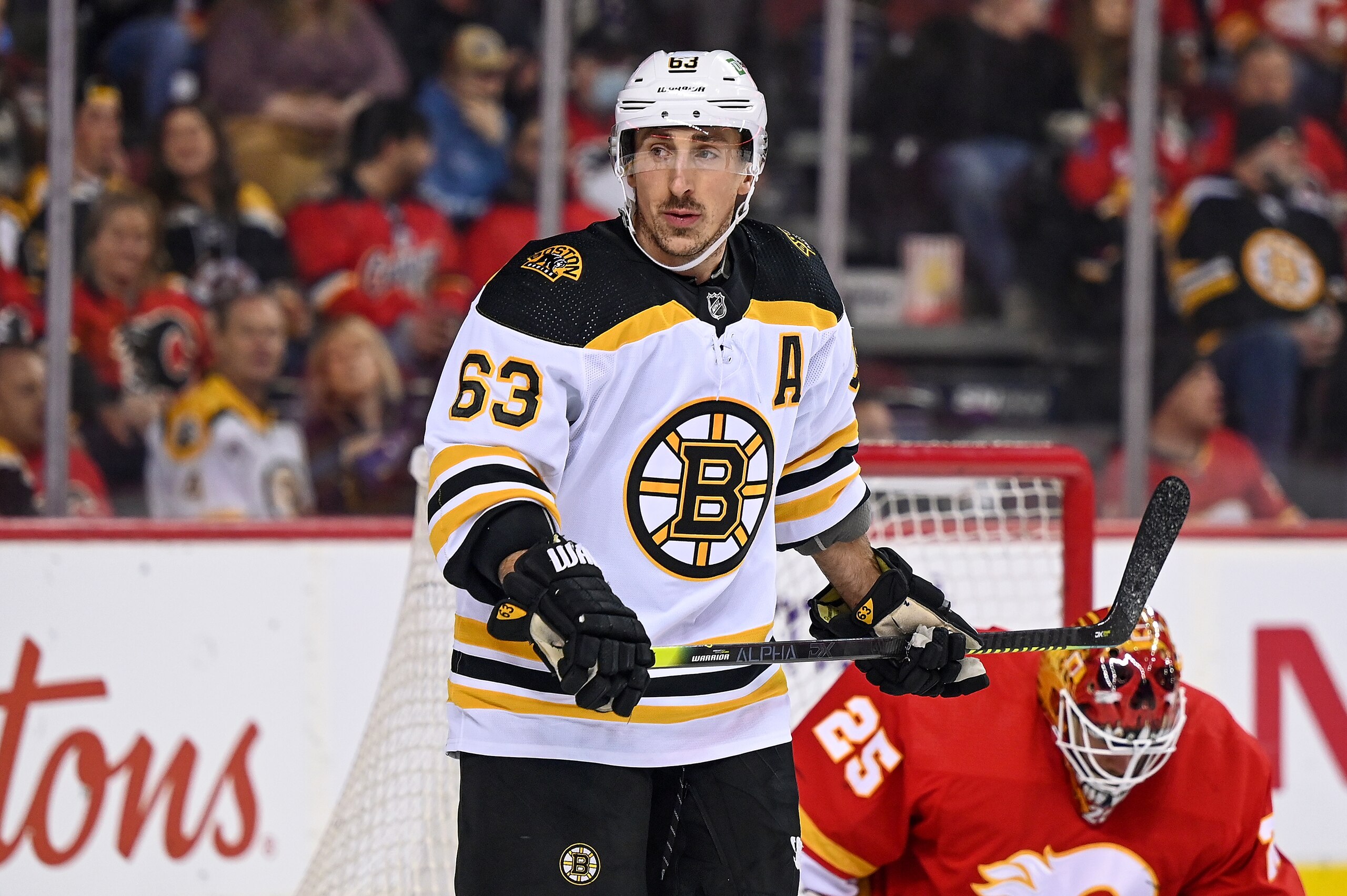 CALGARY, AB - DECEMBER 11: Boston Bruins Left Wing Brad Marchand (63) looks on during the first period of an NHL game where the Calgary Flames hosted the Boston Bruins on December 11, 2021, at the Scotiabank Saddledome in Calgary, AB. (Photo by Brett Holmes/Icon Sportswire via Getty Images)