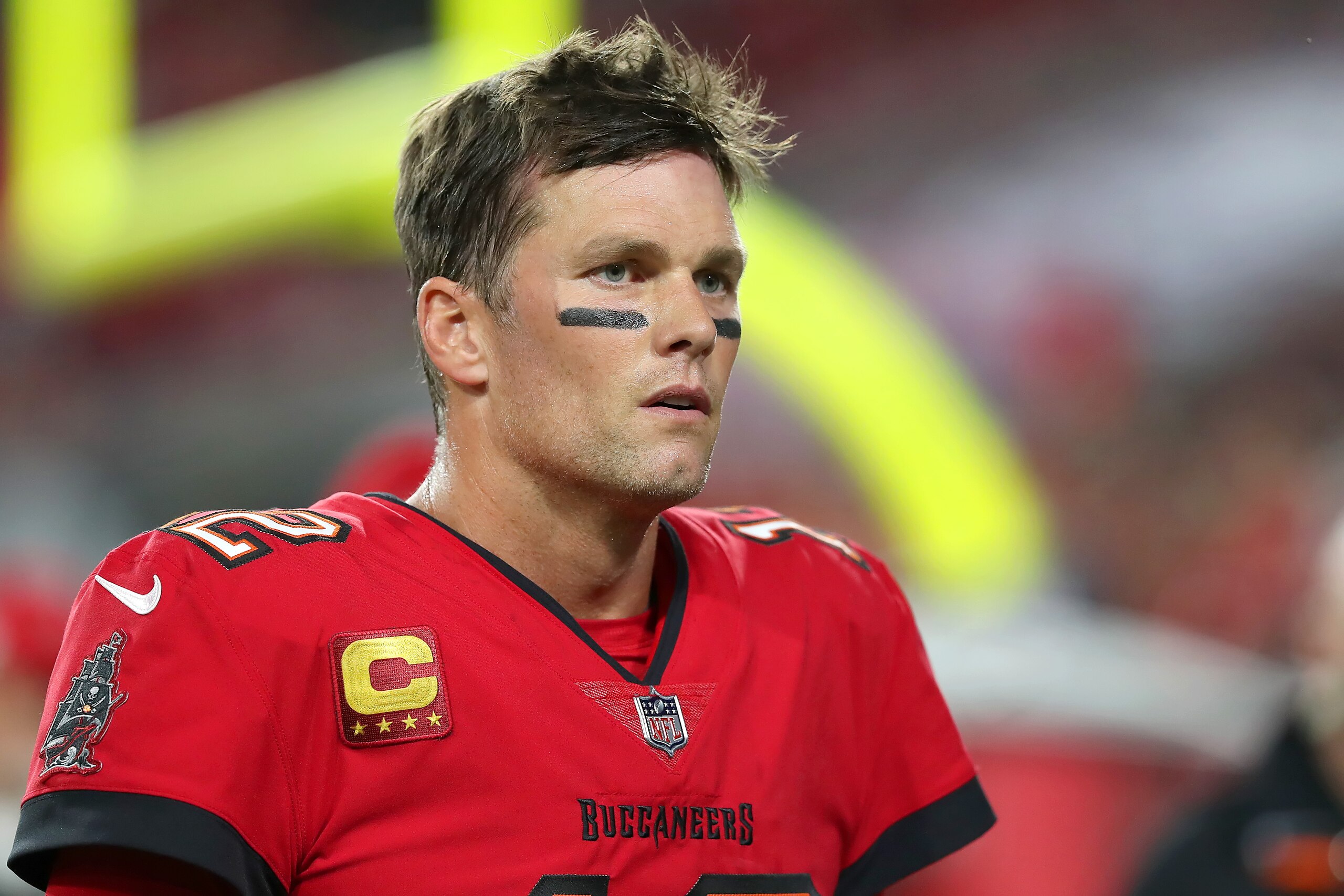 TAMPA, FL - DECEMBER 19: Tampa Bay Buccaneers Quarterback Tom Brady (12) walks off the field during the regular season game between the New Orleans Saints and the Tampa Bay Buccaneers on December 19, 2021 at Raymond James Stadium in Tampa, Florida. (Photo by Cliff Welch/Icon Sportswire via Getty Images)