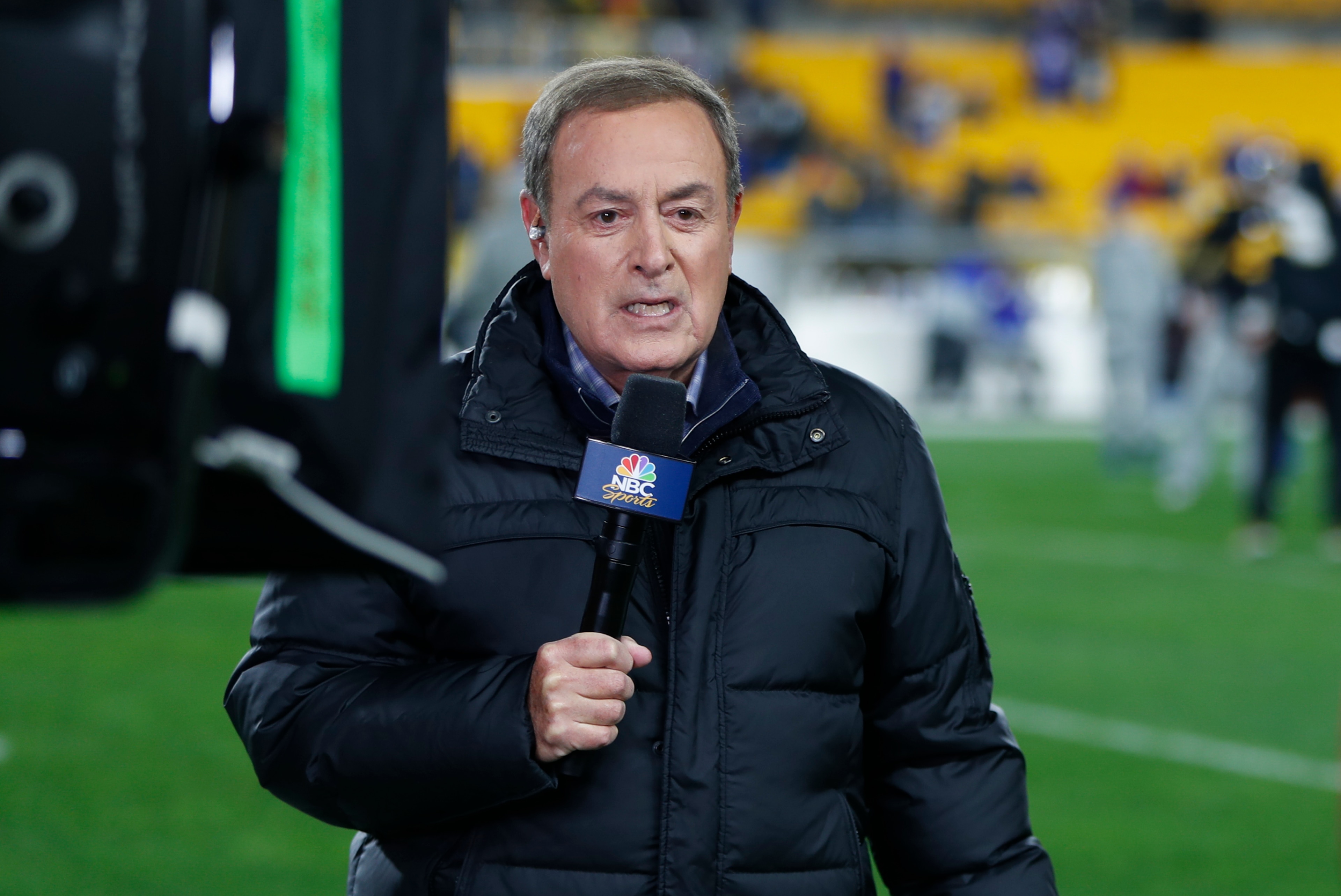 NBC Sports Reporter Al Michaels reports from the sidelines during warm ups before an NFL football game between the Pittsburgh Steelers and the Buffalo Bills in Pittsburgh, Sunday, Dec. 15, 2019. (AP Photo/Keith Srakocic) NBC Sports Reporter Al Michaels reports from the sidelines during warm ups before an NFL football game between the Pittsburgh Steelers and the Buffalo Bills in Pittsburgh, Sunday, Dec. 15, 2019. (AP Photo/Keith Srakocic)