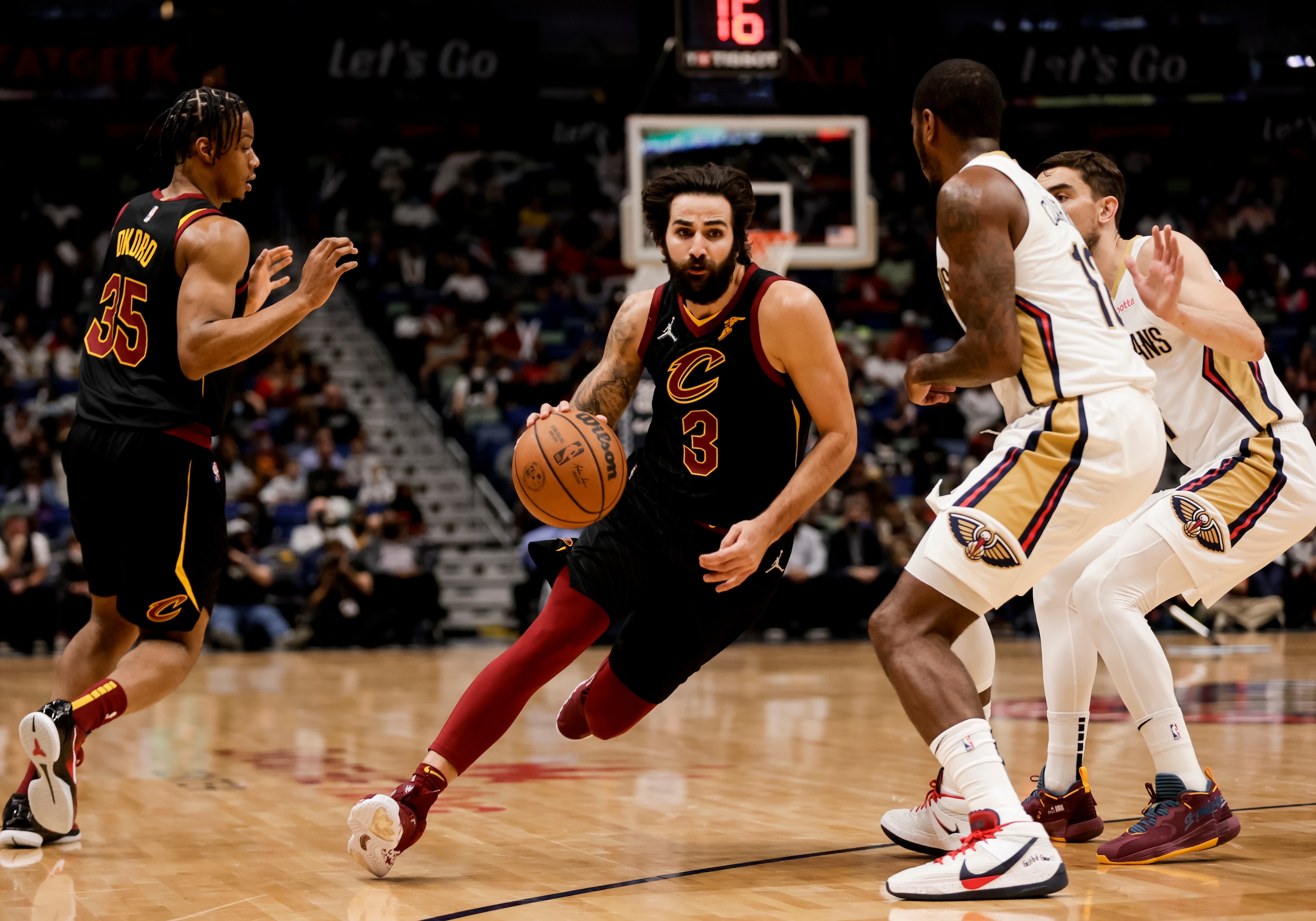 Cleveland Cavaliers guard Ricky Rubio (3) drives past New Orleans Pelicans forward Gary Clark (12) in the first quarter of an NBA basketball game in New Orleans, Tuesday, Dec. 28, 2021. (AP Photo/Derick Hingle)