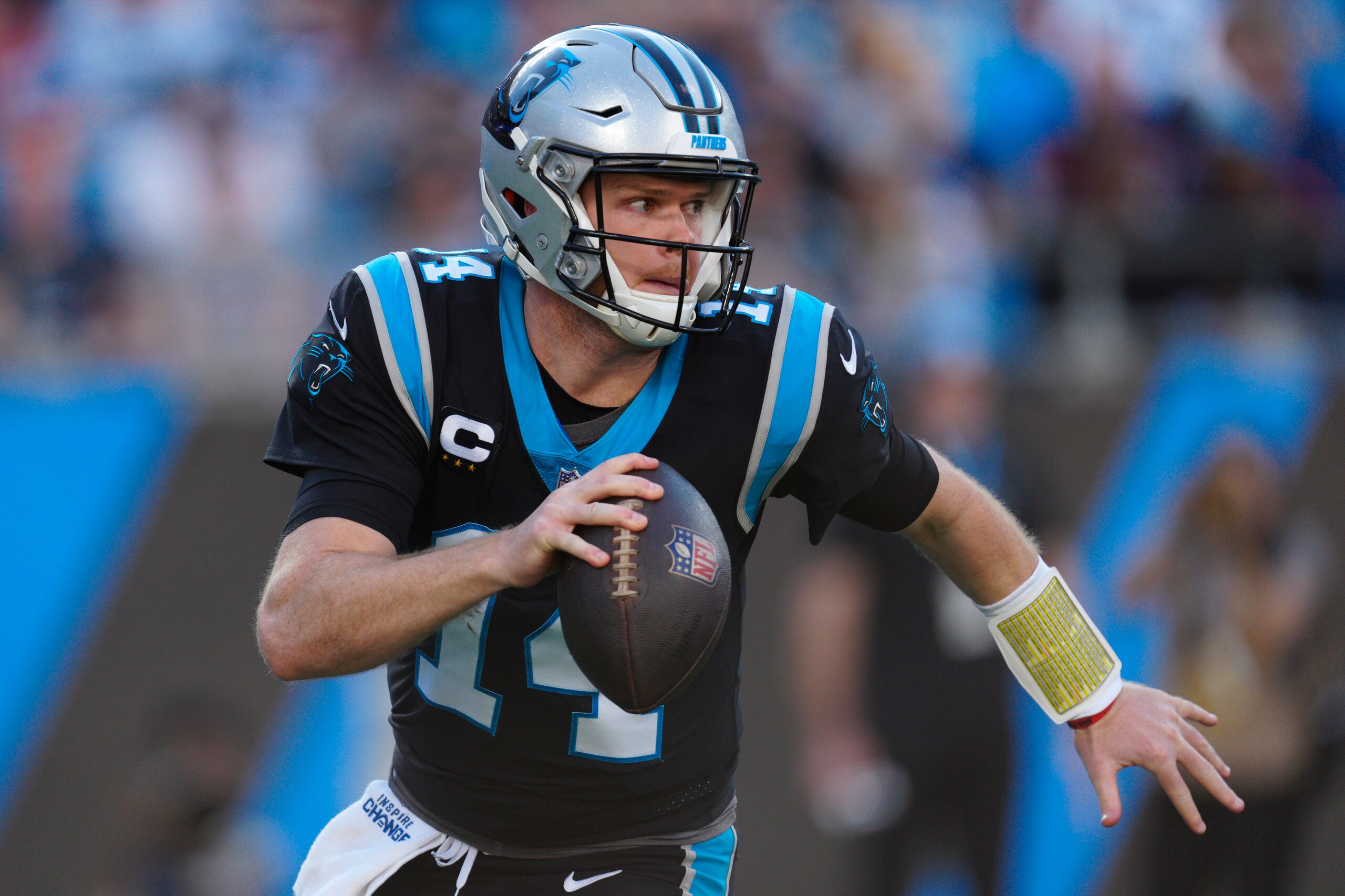 Carolina Panthers quarterback Sam Darnold plays against the Tampa Bay Buccaneers during the second half of an NFL football game Sunday, Dec. 26, 2021, in Charlotte, N.C. (AP Photo/Jacob Kupferman)