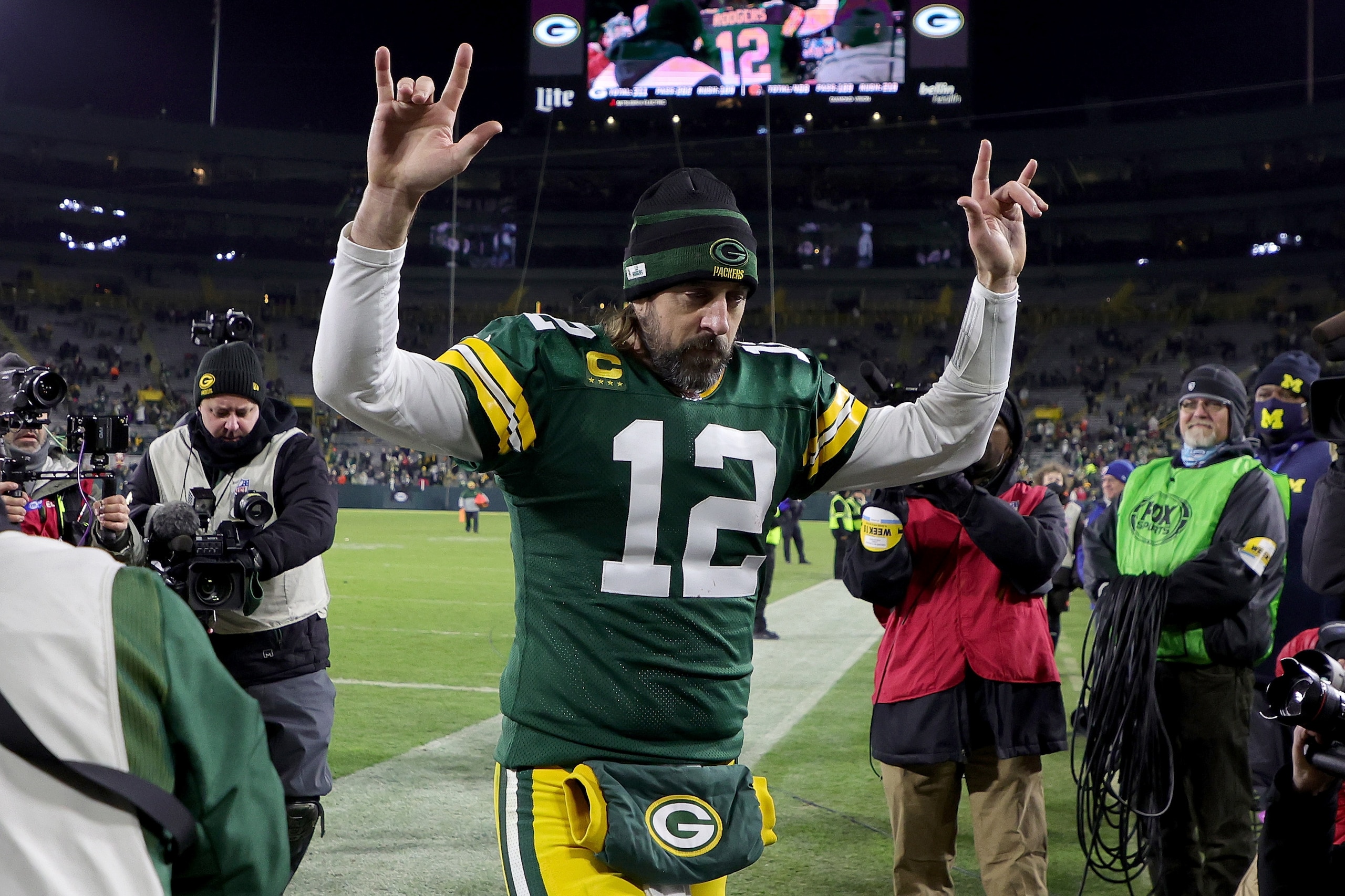 GREEN BAY, WISCONSIN - DECEMBER 25: Aaron Rodgers #12 of the Green Bay Packers walks off the field after beating the Cleveland Browns 24-22 at Lambeau Field on December 25, 2021 in Green Bay, Wisconsin. (Photo by Stacy Revere/Getty Images) GREEN BAY, WISCONSIN - DECEMBER 25: Aaron Rodgers #12 of the Green Bay Packers walks off the field after beating the Cleveland Browns 24-22 at Lambeau Field on December 25, 2021 in Green Bay, Wisconsin. (Photo by Stacy Revere/Getty Images)