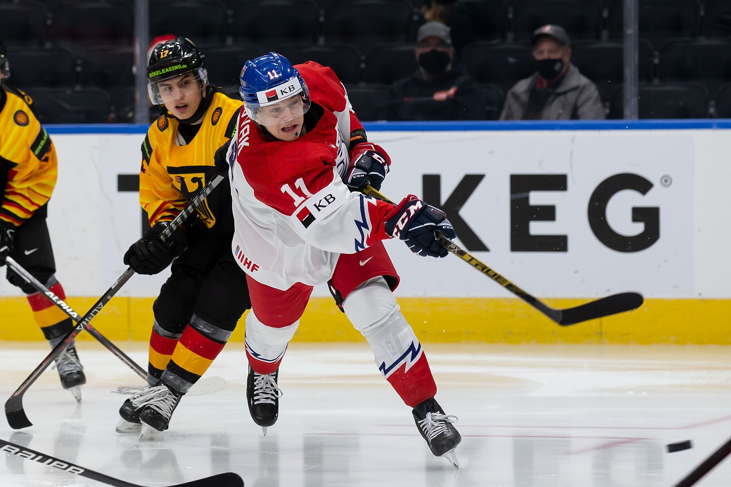 EDMONTON, AB - DECEMBER 27: Pavel Novak #11 of Czechia skates against Fabrizio Pilu #17 of Germany in the third period during the 2022 IIHF World Junior Championship at Rogers Place on December 27, 2021 in Edmonton, Canada. (Photo by Codie McLachlan/Getty Images)
