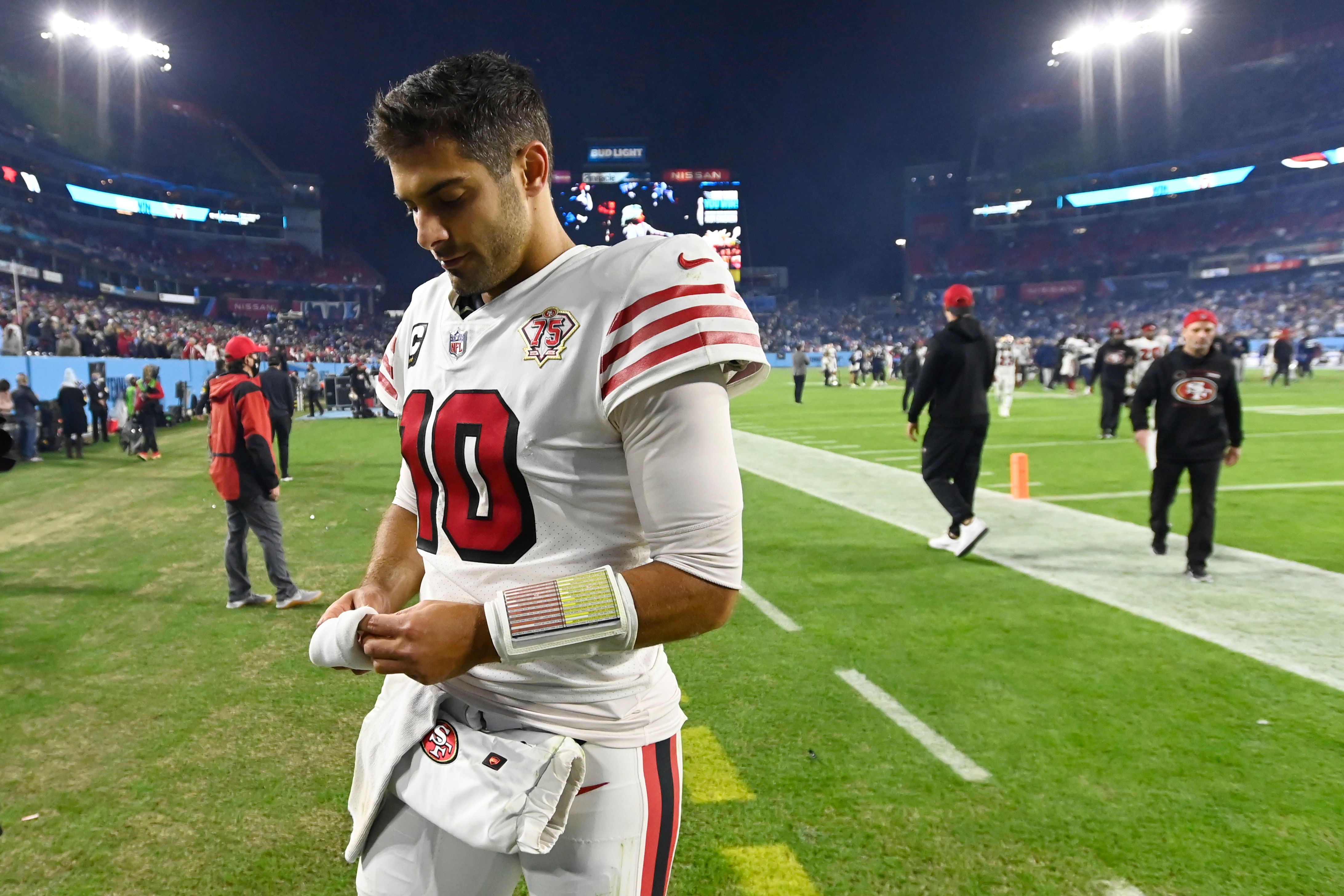 San Francisco 49ers quarterback Jimmy Garoppolo leaves the field after losing to the Tennessee Titans in an NFL football game Thursday, Dec. 23, 2021, in Nashville, Tenn. (AP Photo/Mark Zaleski)