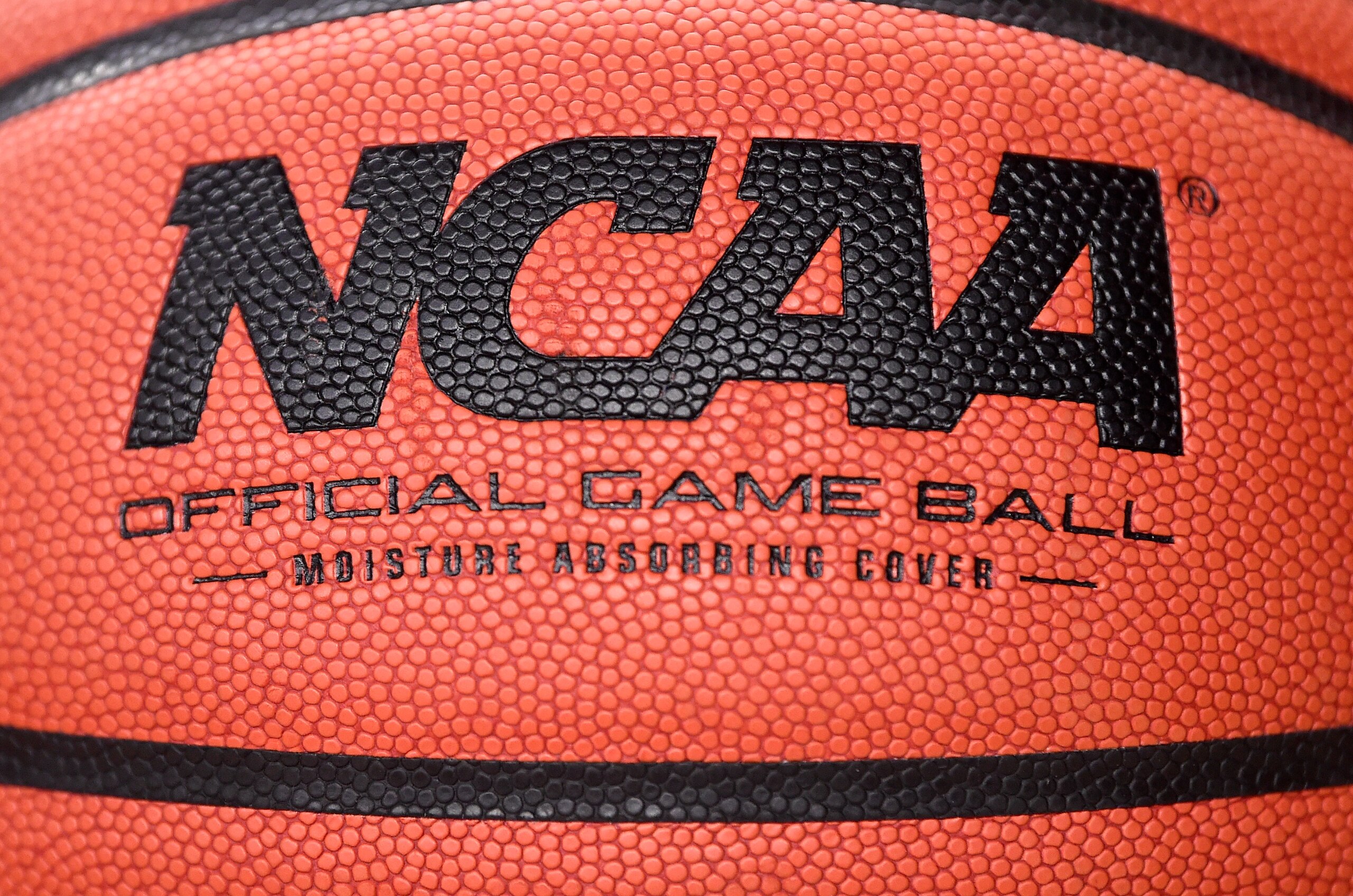 COLLEGE PARK, MD - DECEMBER 31:  A view of the NCAA logo on a basketball before the game between the Maryland Terrapins and the Michigan Wolverines at the Xfinity Center on December 31, 2020 in College Park, Maryland.  (Photo by G Fiume/Maryland Terrapins/Getty Images)