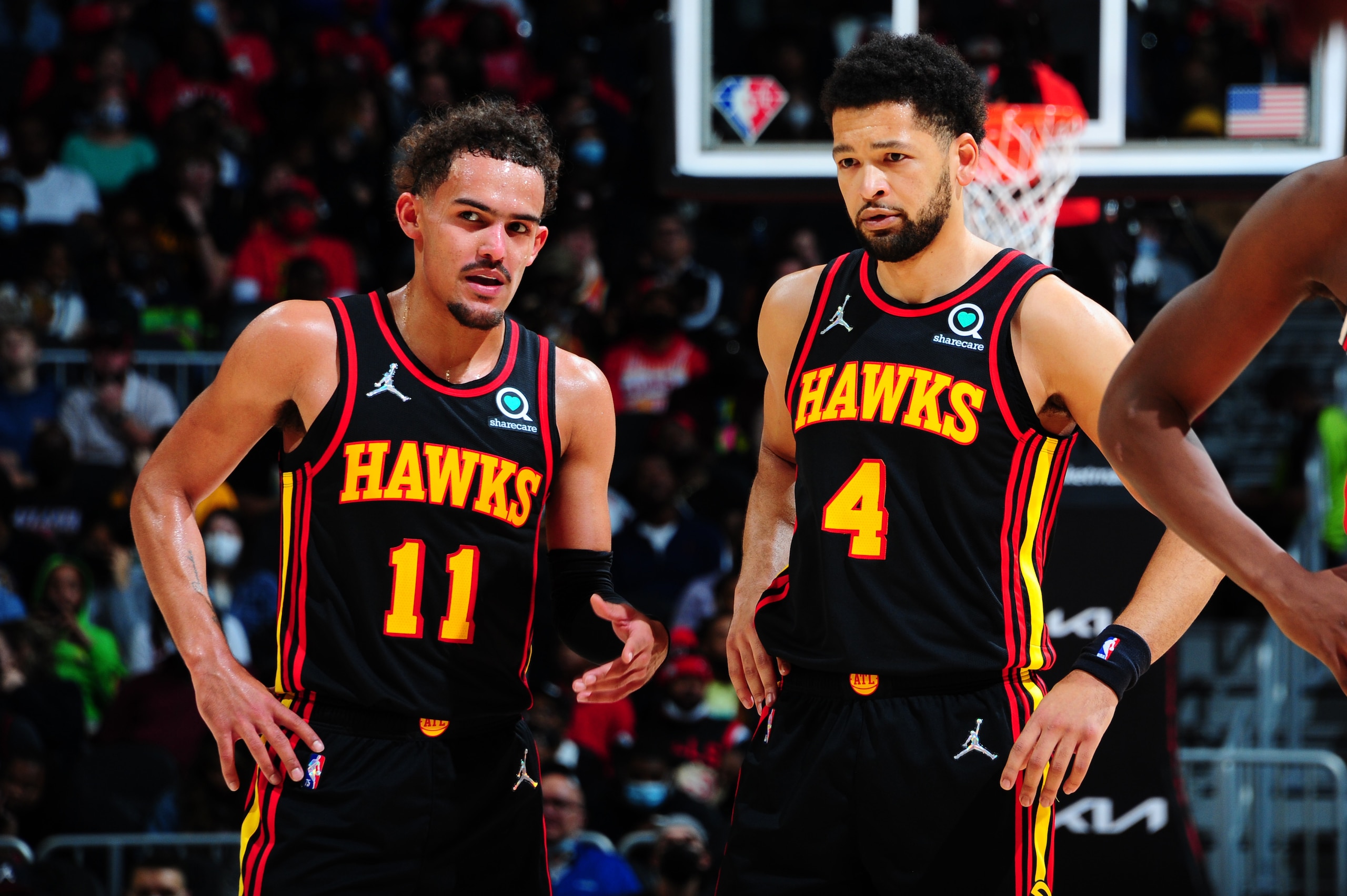 ATLANTA, GA - DECEMBER 27: Trae Young #11 talks with Skylar Mays #4 of the Atlanta Hawks during the game against the Chicago Bulls on December 27, 2021 at State Farm Arena in Atlanta, Georgia.  NOTE TO USER: User expressly acknowledges and agrees that, by downloading and/or using this Photograph, user is consenting to the terms and conditions of the Getty Images License Agreement. Mandatory Copyright Notice: Copyright 2021 NBAE (Photo by Scott Cunningham/NBAE via Getty Images)