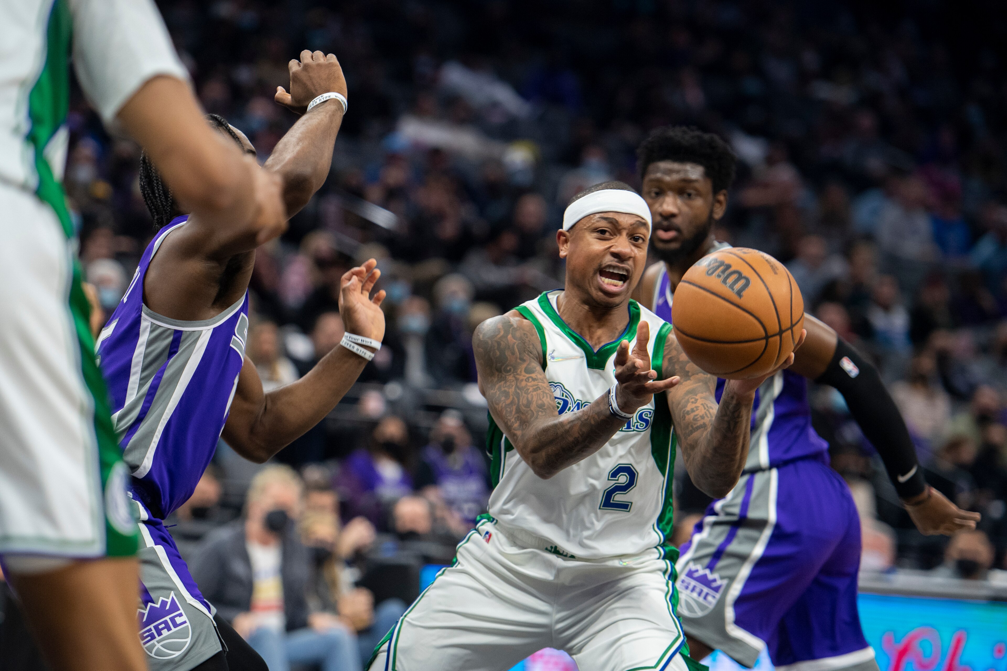 Dallas Mavericks guard Isaiah Thomas (2) passes the ball to a teammate during the first quarter of an NBA basketball game in Sacramento, Calif., Wednesday, Dec. 29, 2021. (AP Photo/José Luis Villegas)