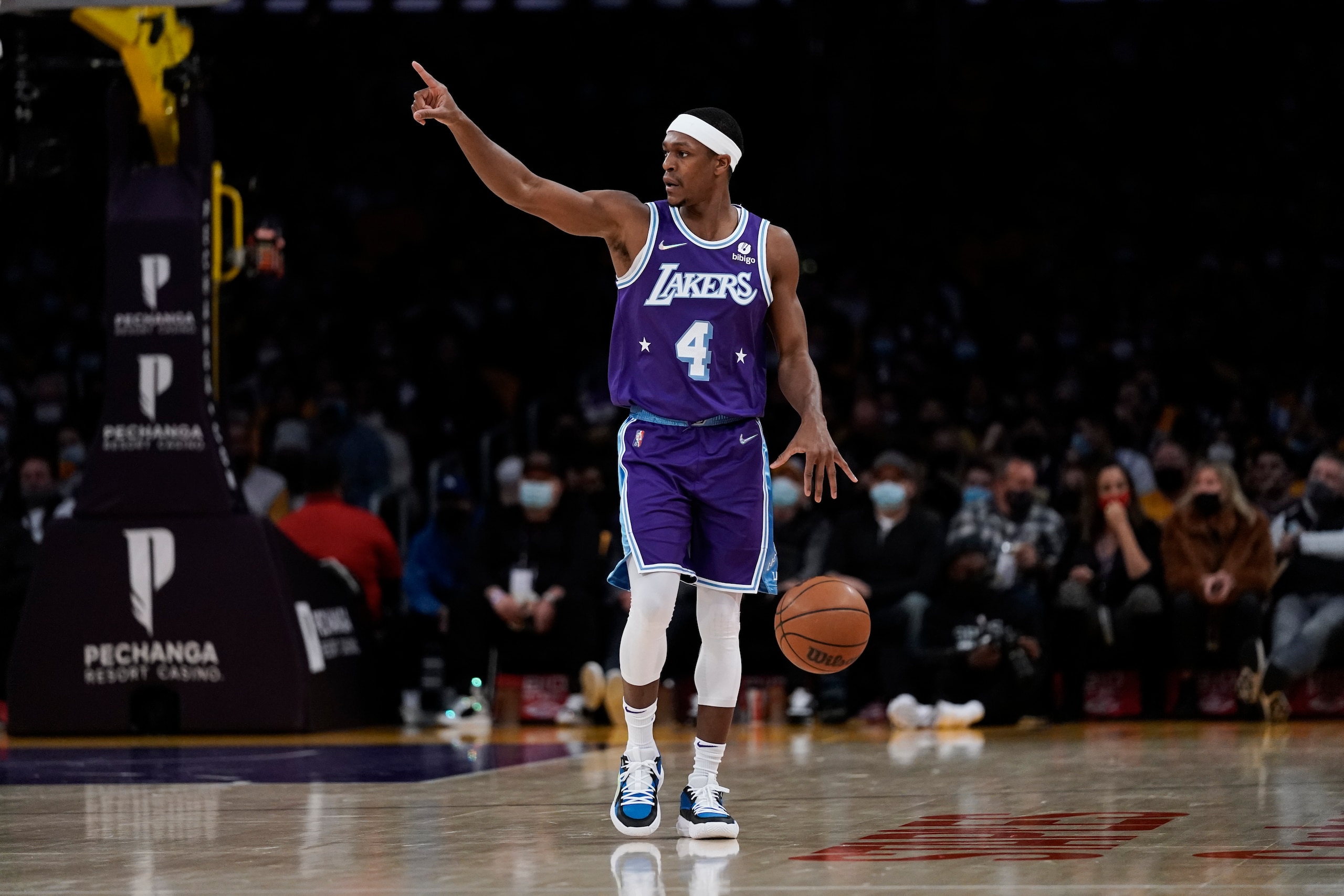 Los Angeles Lakers' Rajon Rondo dribbles the ball during first half of an NBA basketball game against the San Antonio Spurs Thursday, Dec. 23, 2021, in Los Angeles. (AP Photo/Jae C. Hong)