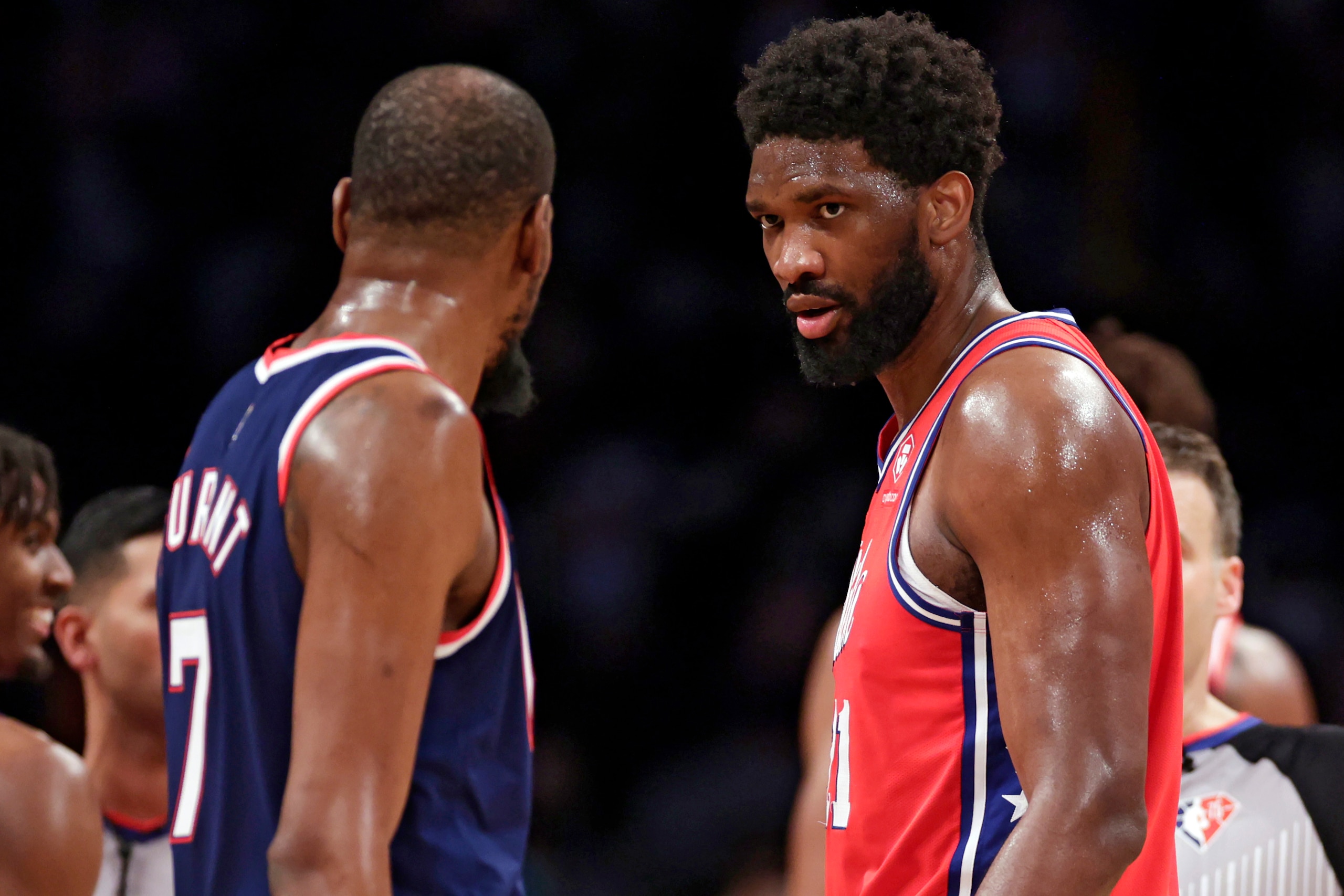 Philadelphia 76ers center Joel Embiid stares down Brooklyn Nets forward Kevin Durant during the second half of an NBA basketball game Thursday, Dec. 30, 2021, in New York. 76ers won 110-102. (AP Photo/Adam Hunger)