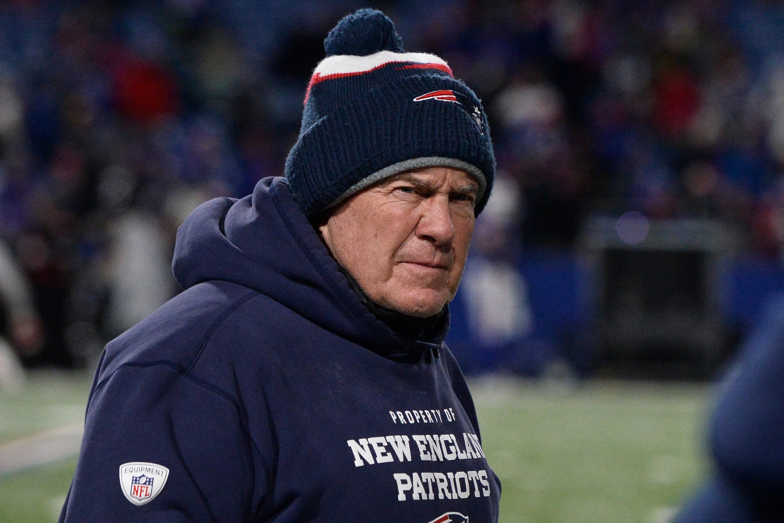 New England Patriots head coach Bill Belichick takes the field for an NFL football game between the Buffalo Bills and the New England Patriots in Orchard Park, N.Y., Monday, Dec. 6, 2021. (AP Photo/Adrian Kraus)
