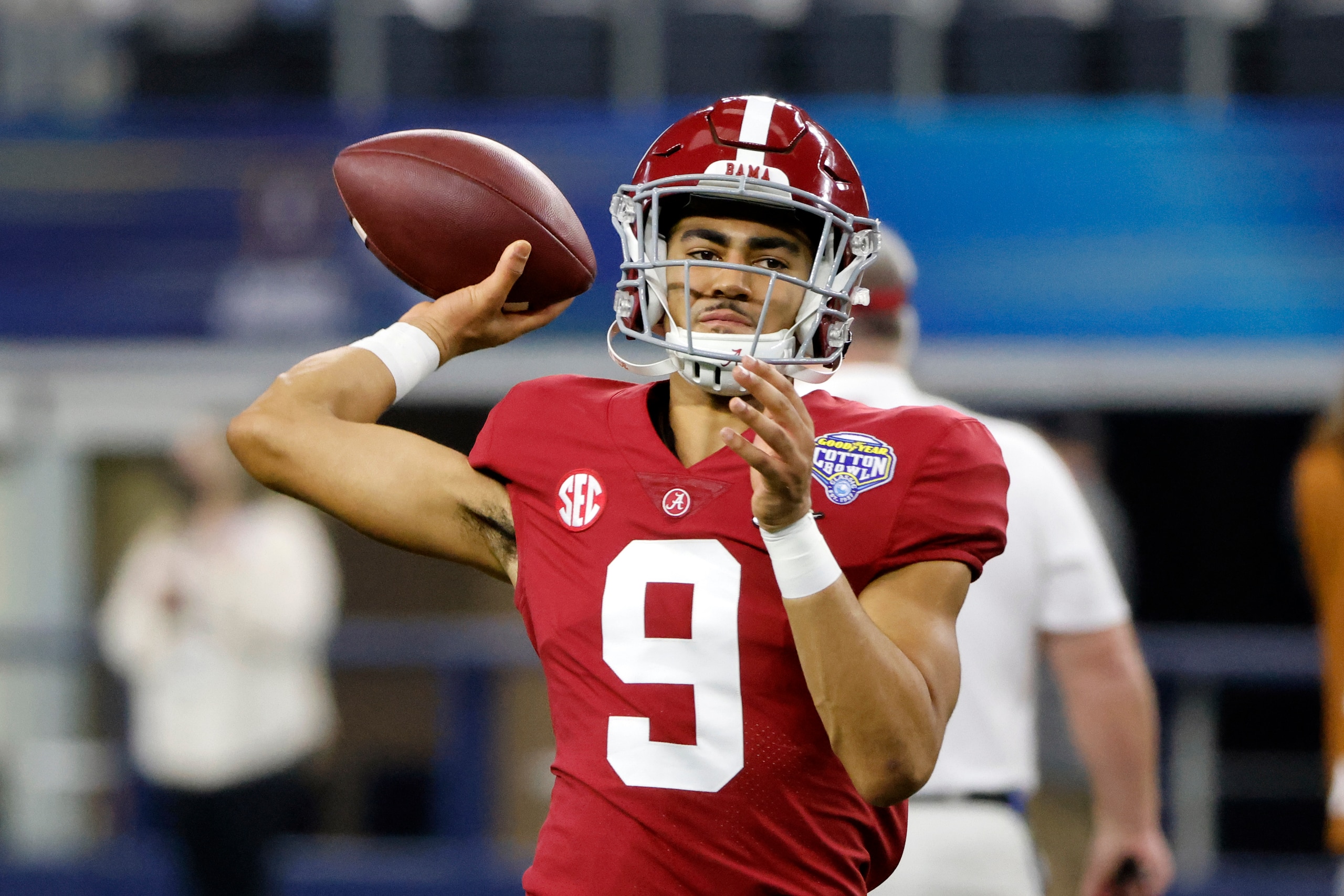 Alabama quarterback Bryce Young (9) warms up before the Cotton Bowl NCAA College Football Playoff semifinal game against Cincinnati, Friday, Dec. 31, 2021, in Arlington, Texas. (AP Photo/Michael Ainsworth) Alabama quarterback Bryce Young (9) warms up before the Cotton Bowl NCAA College Football Playoff semifinal game against Cincinnati, Friday, Dec. 31, 2021, in Arlington, Texas. (AP Photo/Michael Ainsworth)