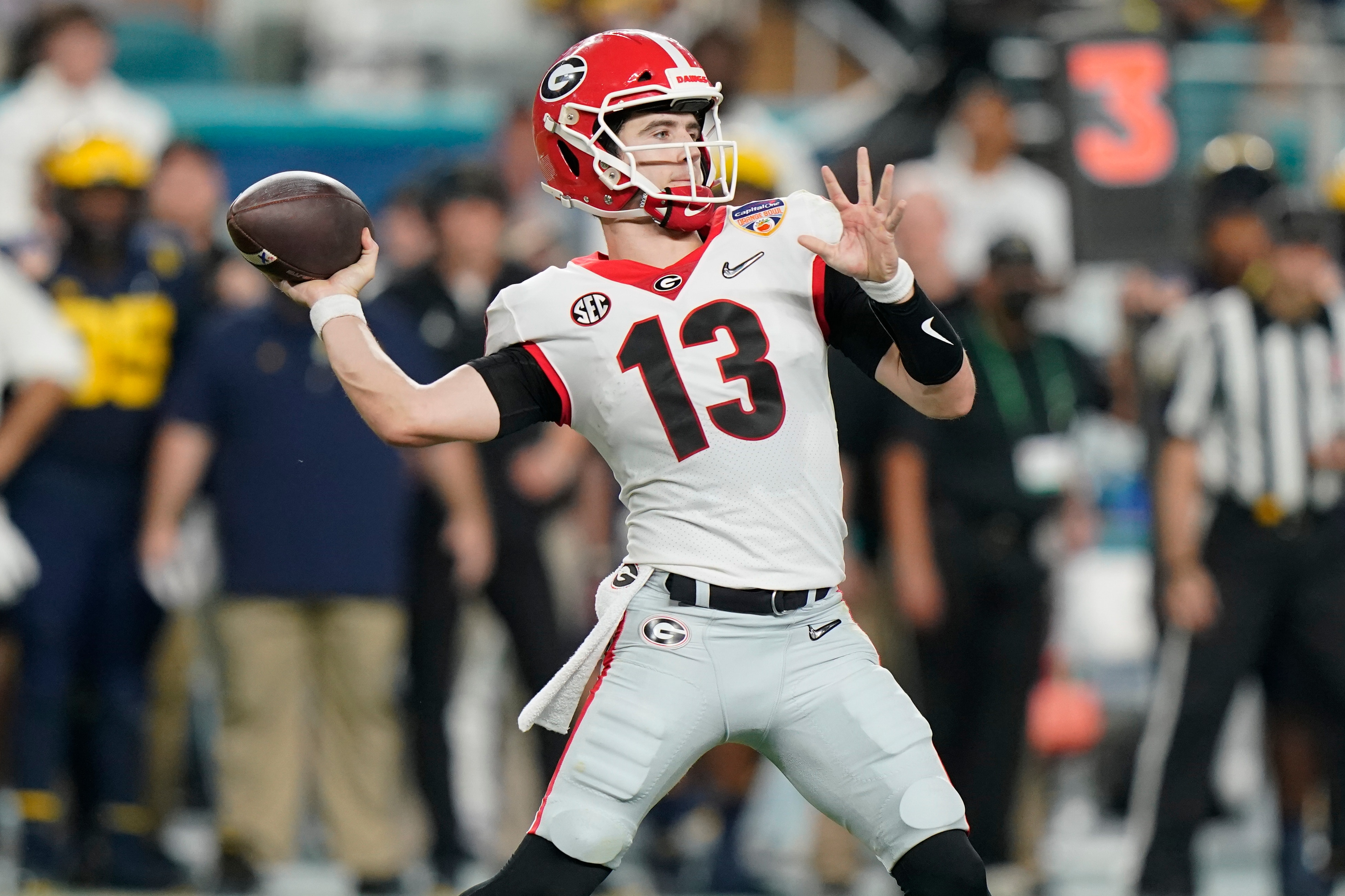 Georgia quarterback Stetson Bennett passes against Michigan during the first half of the Orange Bowl NCAA College Football Playoff semifinal game, Friday, Dec. 31, 2021, in Miami Gardens, Fla. (AP Photo/Lynne Sladky)