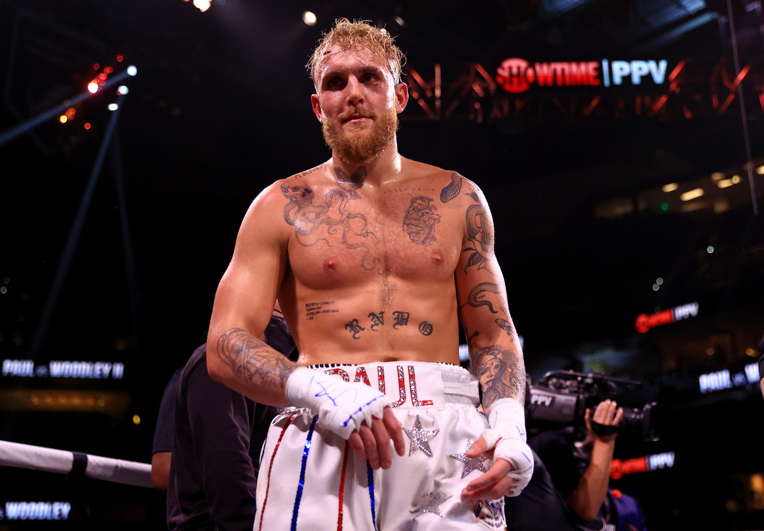 TAMPA, FLORIDA - DECEMBER 18:  Jake Paul reacts to knocking out Tyron Woddley in the sixth round during an eight-round cruiserweight bout at the Amalie Arena on December 18, 2021 in Tampa, Florida. (Photo by Mike Ehrmann/Getty Images)