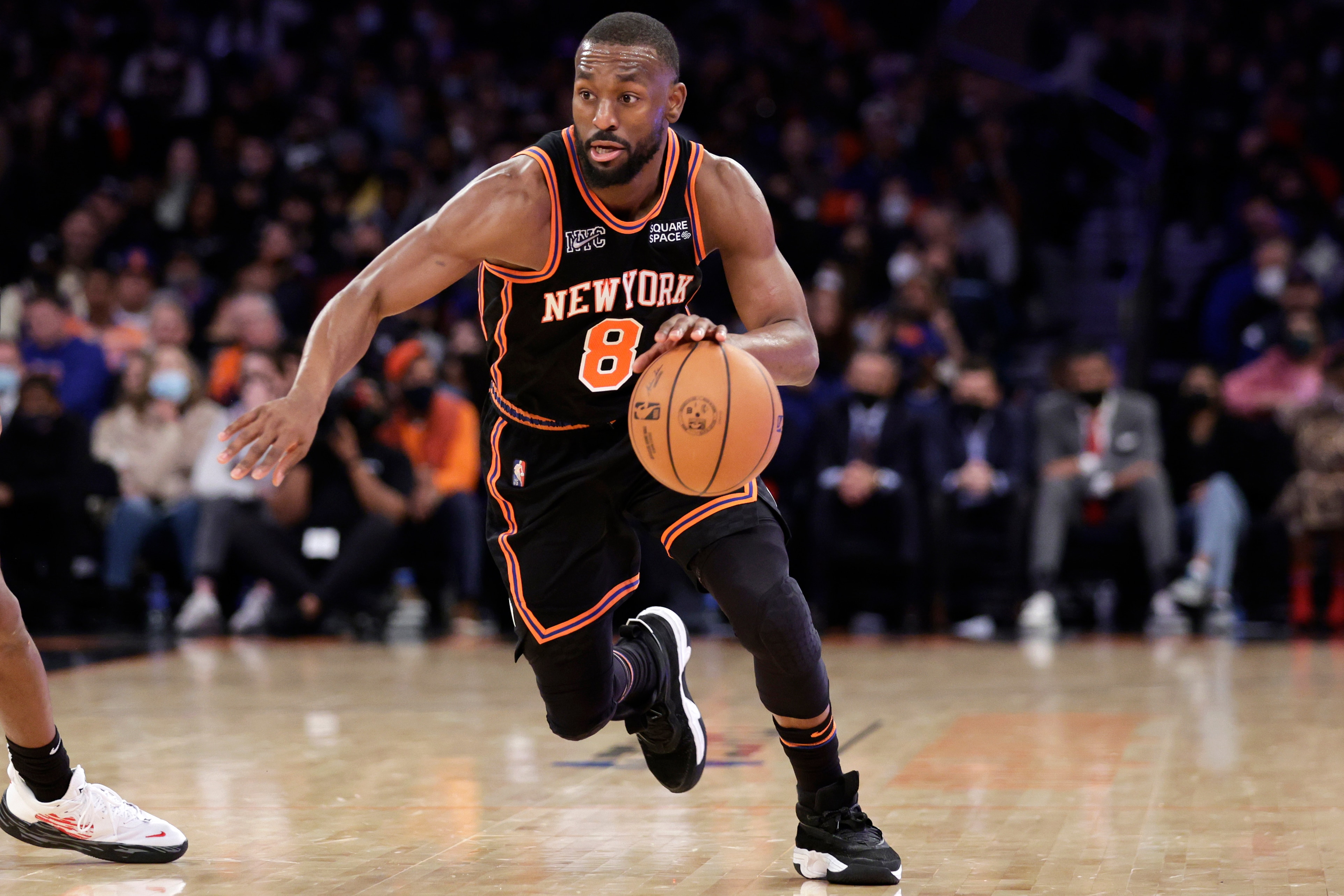 New York Knicks guard Kemba Walker (8) drives against the Atlanta Hawks during the second half of an NBA basketball game Saturday, Dec. 25, 2021, in New York. The Knicks won 101-87. (AP Photo/Adam Hunger)