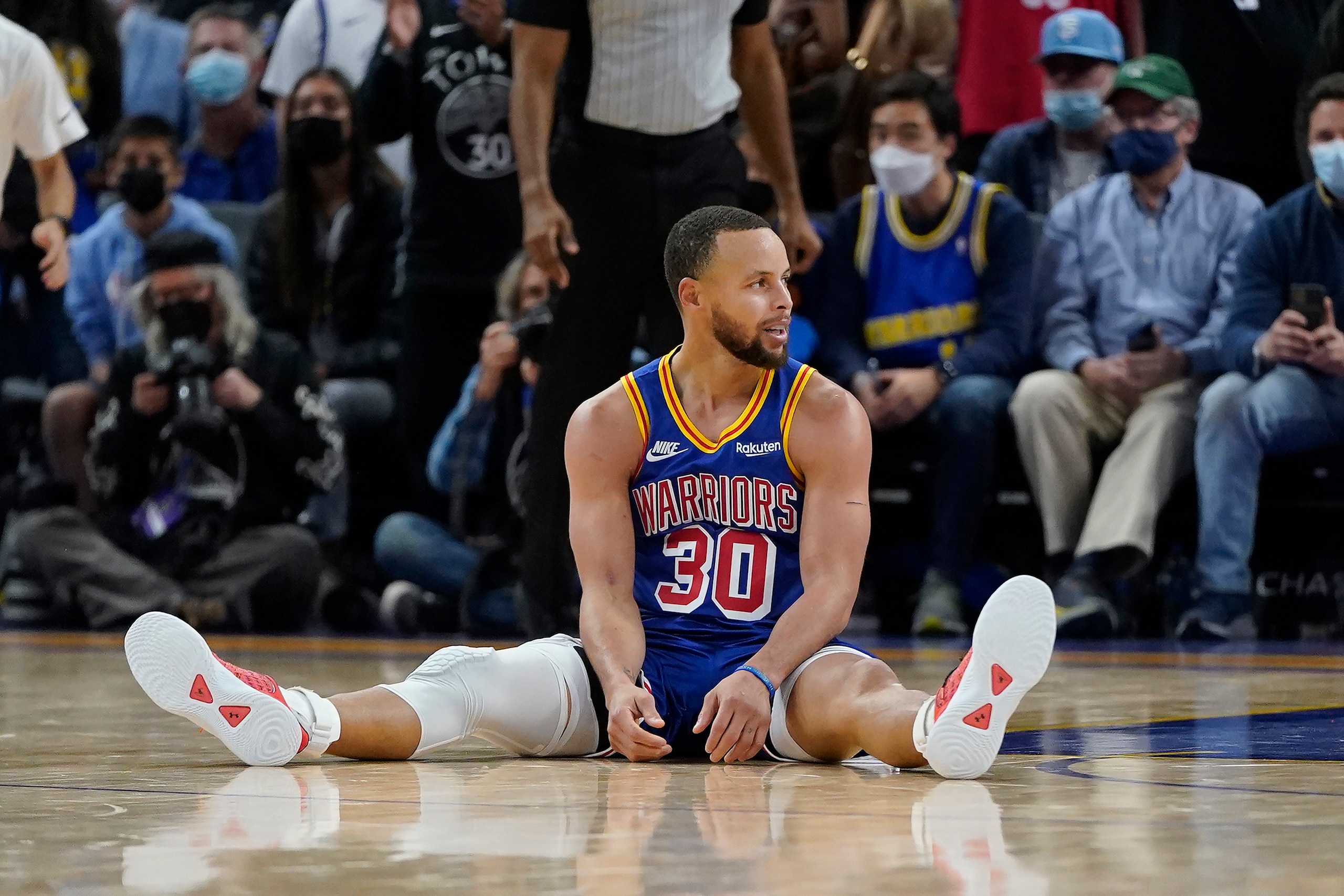 Golden State Warriors guard Stephen Curry reacts after being called for a foul during the second half of the team's NBA basketball game against the Denver Nuggets in San Francisco, Tuesday, Dec. 28, 2021. (AP Photo/Jeff Chiu)