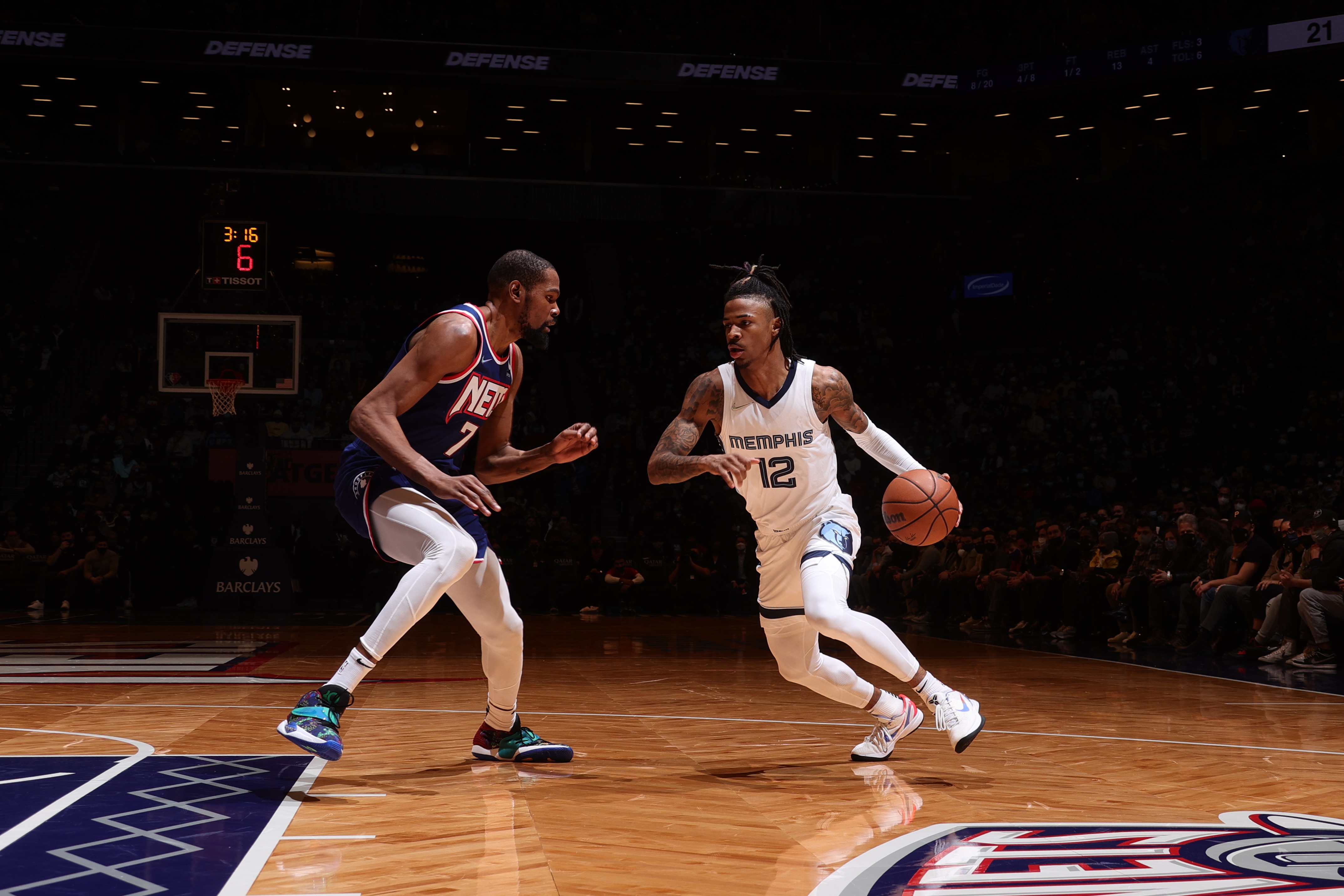 BROOKLYN, NY - JANUARY 3: Kevin Durant #7 of the Brooklyn Nets plays defense on Ja Morant #12 of the Memphis Grizzlies during the game against the Brooklyn Nets on January 3, 2022 at Barclays Center in Brooklyn, New York. NOTE TO USER: User expressly acknowledges and agrees that, by downloading and or using this Photograph, user is consenting to the terms and conditions of the Getty Images License Agreement. Mandatory Copyright Notice: Copyright 2022 NBAE (Photo by Nathaniel S. Butler/NBAE via Getty Images)