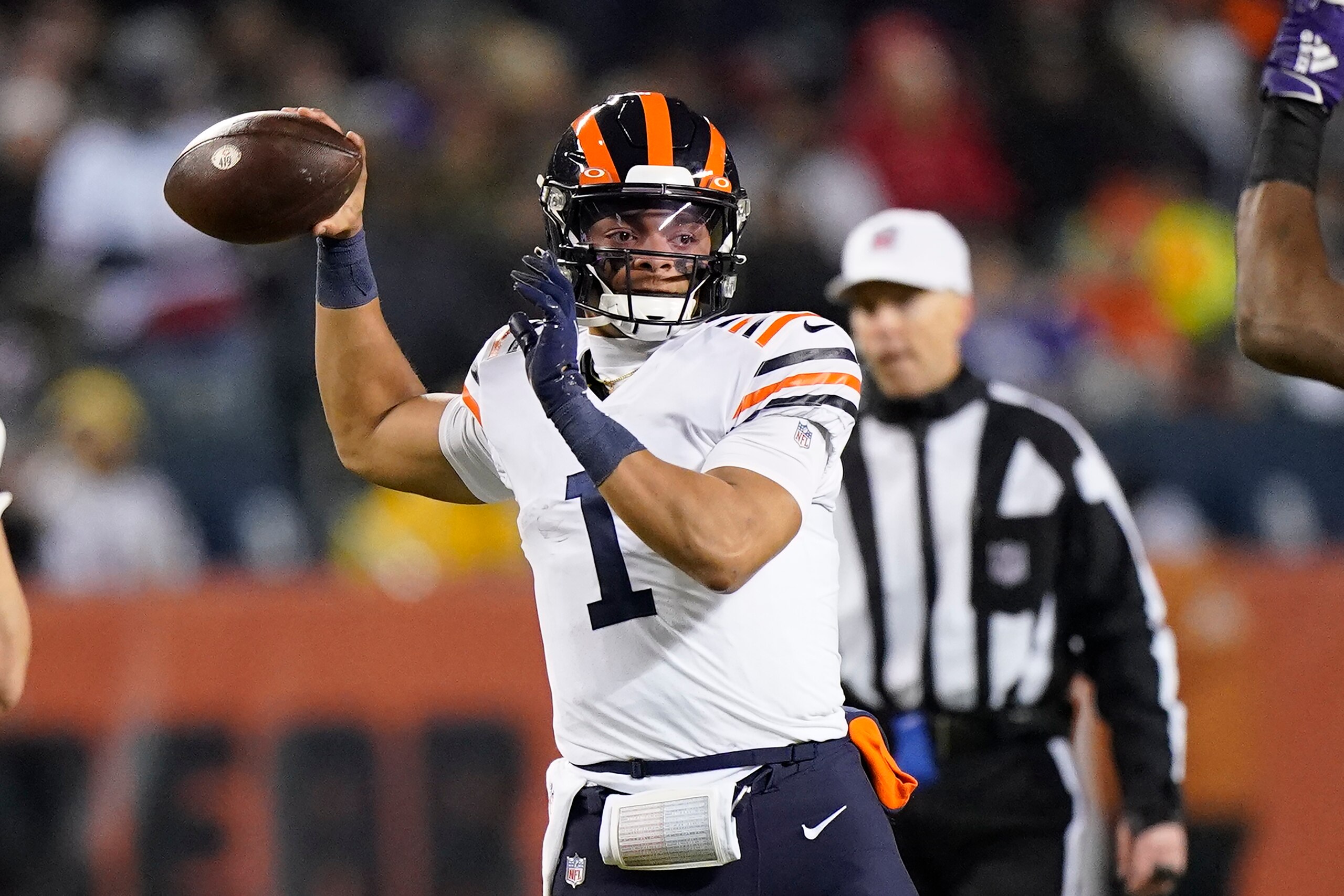 Chicago Bears quarterback Justin Fields passes during the first half of an NFL football game against the Minnesota Vikings Monday, Dec. 20, 2021, in Chicago. (AP Photo/Nam Y. Huh)