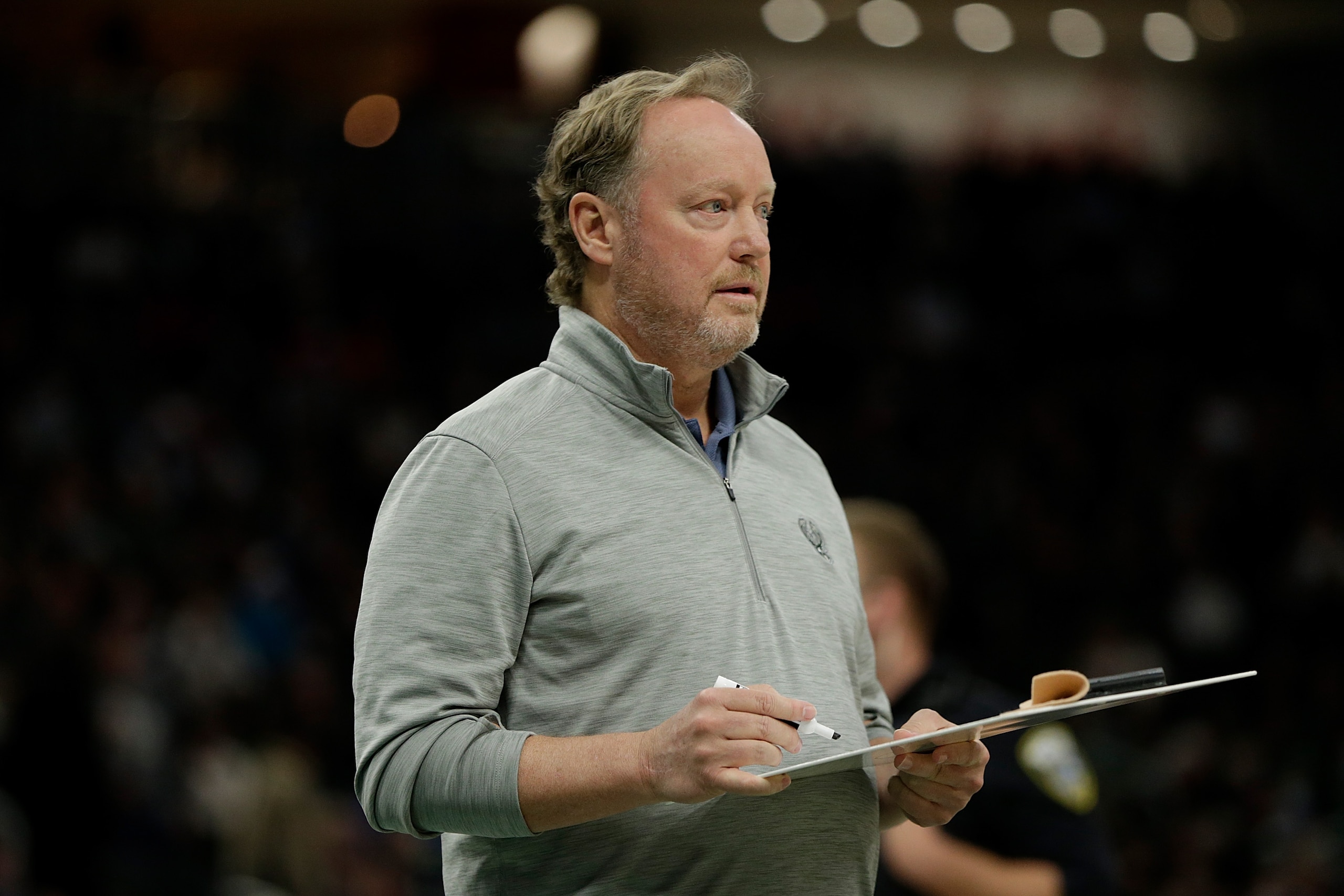 MILWAUKEE, WISCONSIN - DECEMBER 18: Mike Budenholzer Head Coach of the Milwaukee Bucks during a timeout in the first half against the Cleveland Cavaliers at Fiserv Forum on December 18, 2021 in Milwaukee, Wisconsin. NOTE TO USER: User expressly acknowledges and agrees that, by downloading and or using this photograph, User is consenting to the terms and conditions of the Getty Images License Agreement. (Photo by John Fisher/Getty Images)