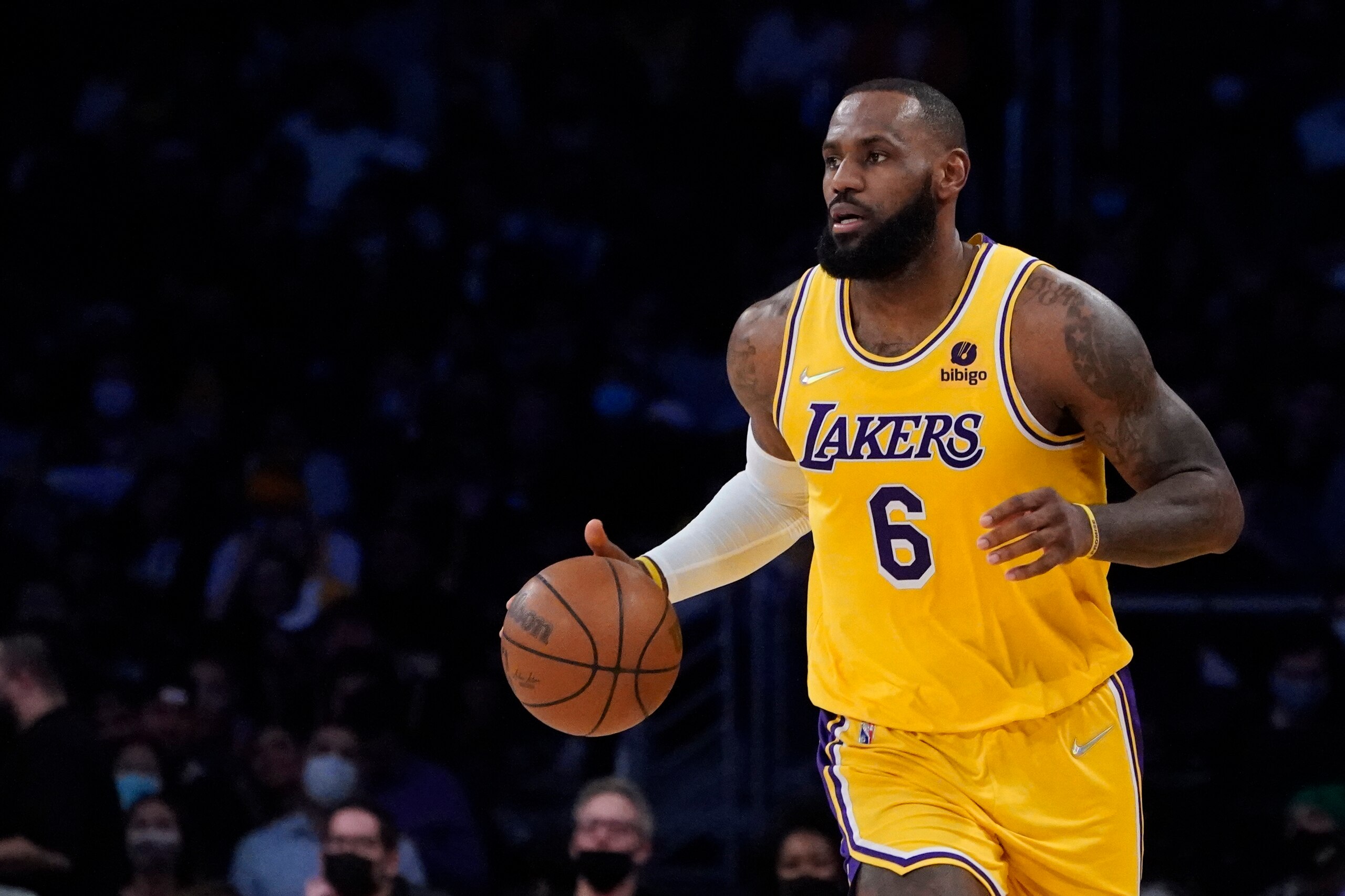 Los Angeles Lakers forward LeBron James (6) dribbles during the first half of an NBA basketball game against the Sacramento Kings Tuesday, Jan. 4, 2022, in Los Angeles. (AP Photo/Marcio Jose Sanchez)