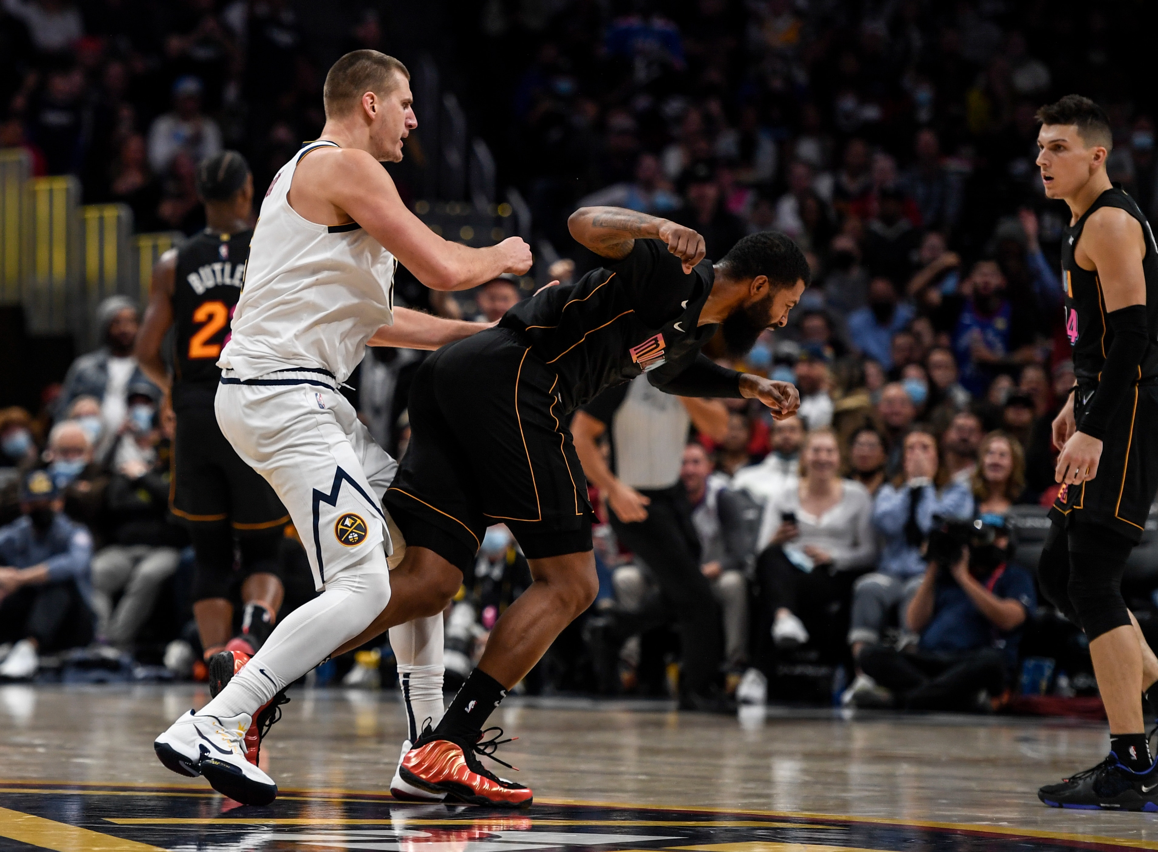 DENVER, CO - NOVEMBER 8: Nikola Jokic (15) of the Denver Nuggets hits Markieff Morris (8) of the Miami Heat with a retaliatory blow after Morris bumped Jokic near mid court during the fourth quarter of Denver"u2019s 113-96 win on Monday, November 8, 2021. The altercation resulted in an ejection for Jokic and a flagrant and two for Morris. (Photo by AAron Ontiveroz/MediaNews Group/The Denver Post via Getty Images)