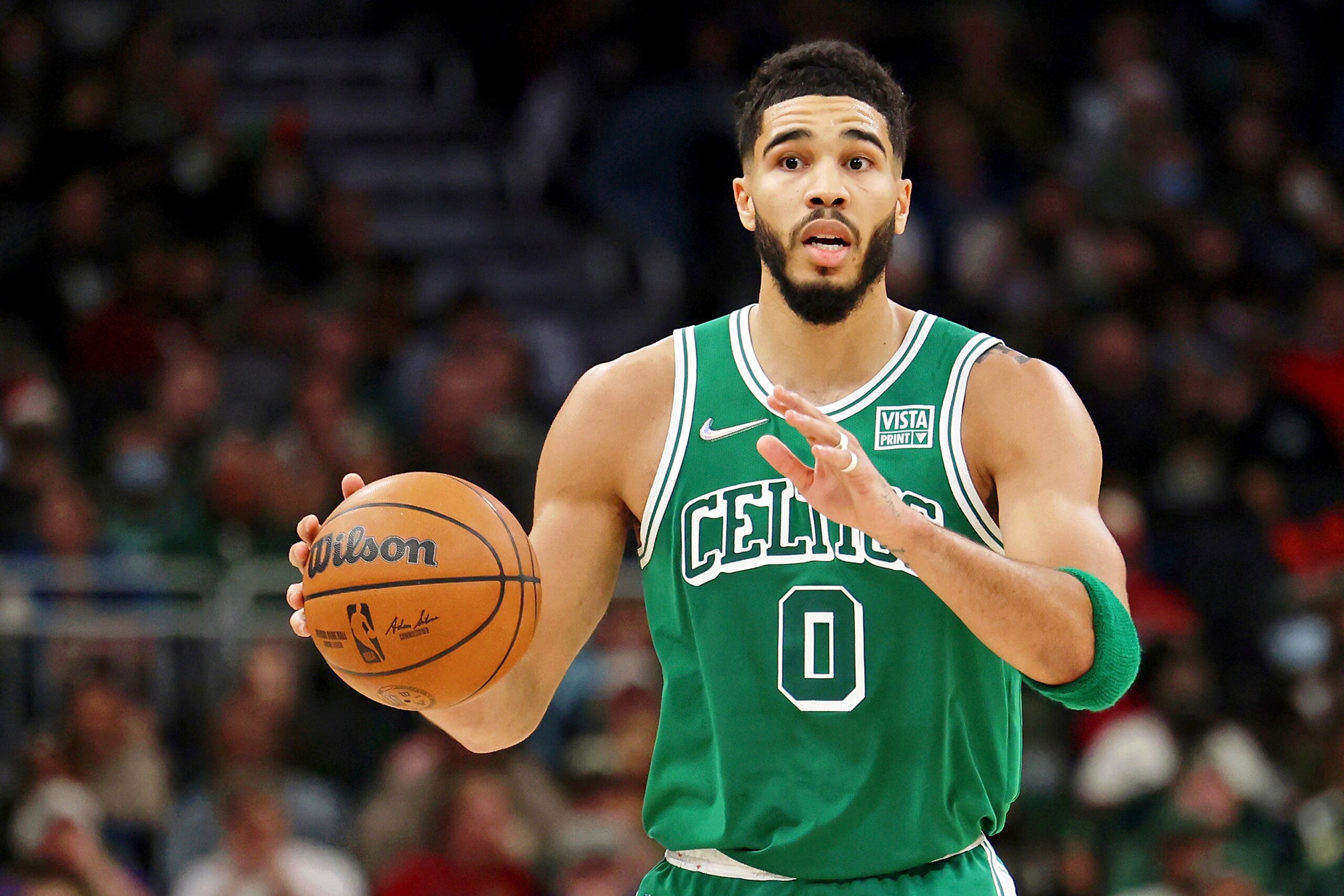 Boston Celtics forward Jayson Tatum (0) gestures to teammates against the Milwaukee Bucks during the second half of an NBA basketball game Saturday, Dec. 25, 2021, in Milwaukee. The Milwaukee Bucks won 117-113. (AP Photo/Jon Durr) Boston Celtics forward Jayson Tatum (0) gestures to teammates against the Milwaukee Bucks during the second half of an NBA basketball game Saturday, Dec. 25, 2021, in Milwaukee. The Milwaukee Bucks won 117-113. (AP Photo/Jon Durr)