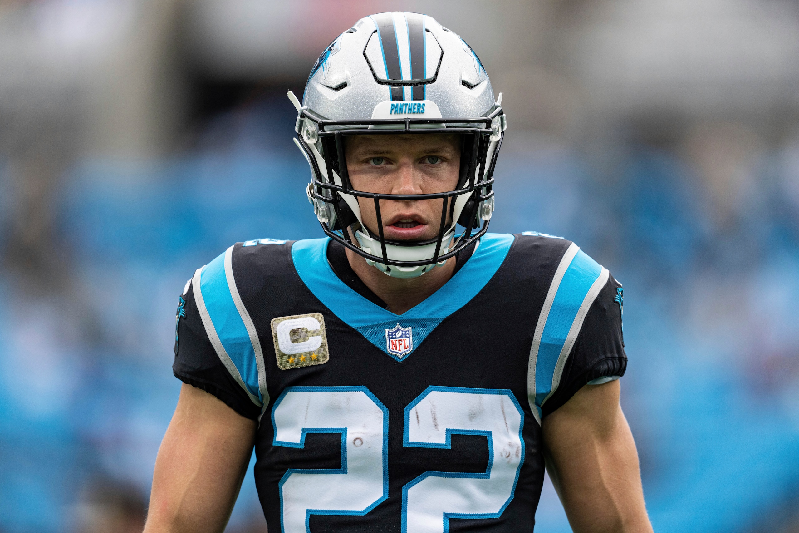 Carolina Panthers running back Christian McCaffrey (22) warms up before an NFL football game against the Washington Football Team Sunday, Nov. 21, 2021, in Charlotte, N.C. (AP Photo/Jacob Kupferman)