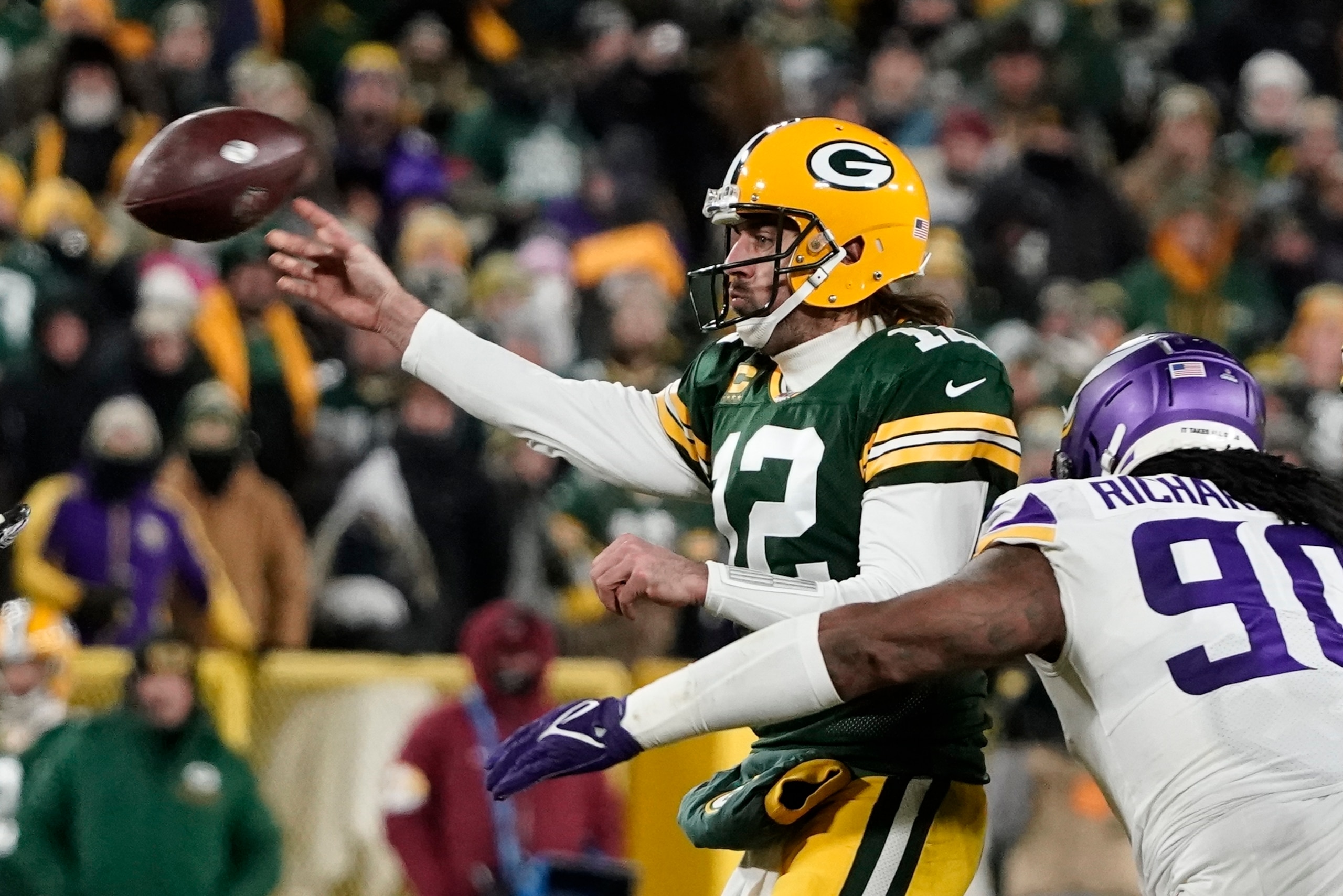 Green Bay Packers' Aaron Rodgers thorws during the second half of an NFL football game against the Minnesota Vikings Sunday, Jan. 2, 2022, in Green Bay, Wis. (AP Photo/Morry Gash)