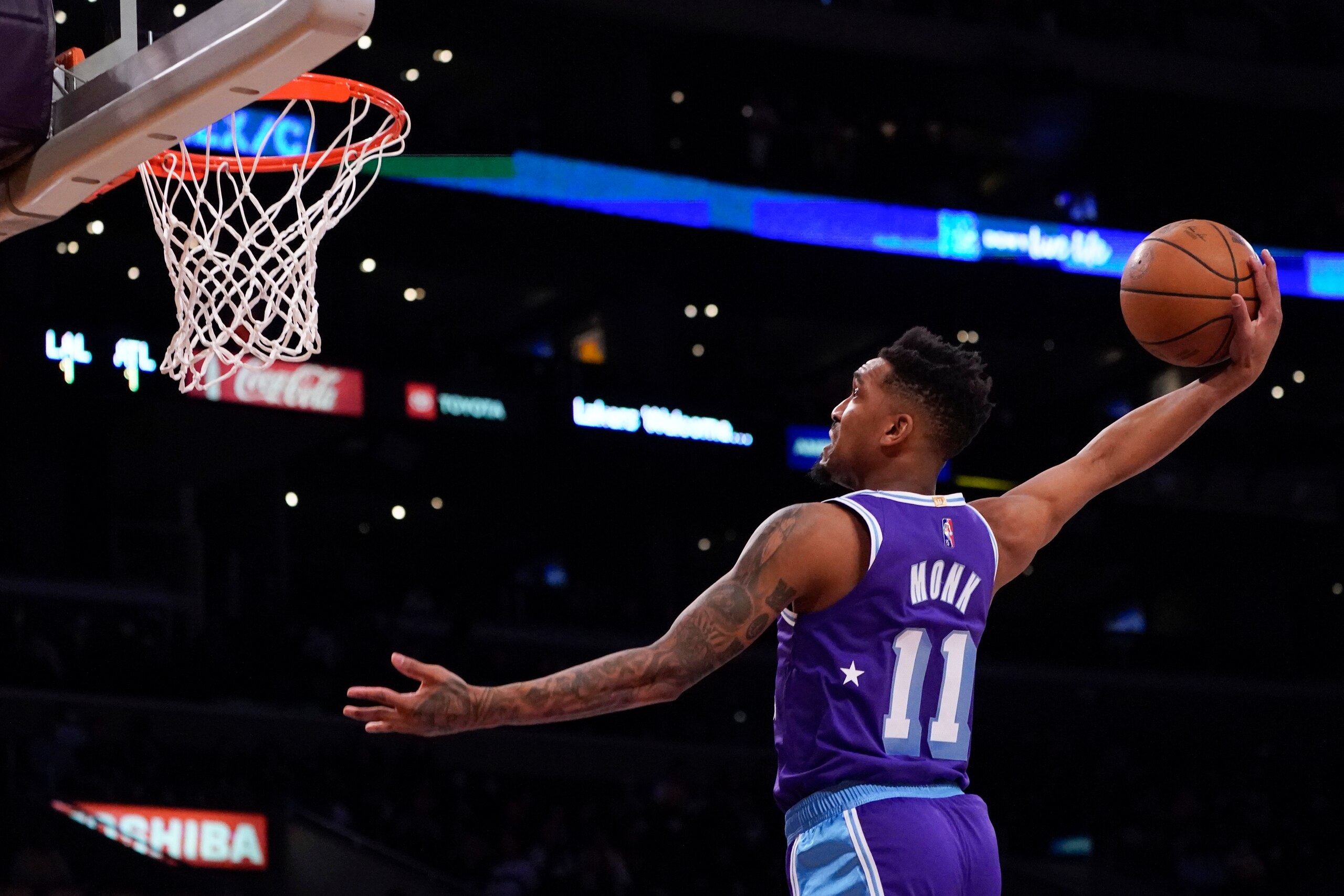 Los Angeles Lakers guard Malik Monk (11) dunks the ball during the first half of an NBA basketball game against the Atlanta Hawks in Los Angeles, Friday, Jan. 7, 2022. (AP Photo/Ashley Landis) Los Angeles Lakers guard Malik Monk (11) dunks the ball during the first half of an NBA basketball game against the Atlanta Hawks in Los Angeles, Friday, Jan. 7, 2022. (AP Photo/Ashley Landis)