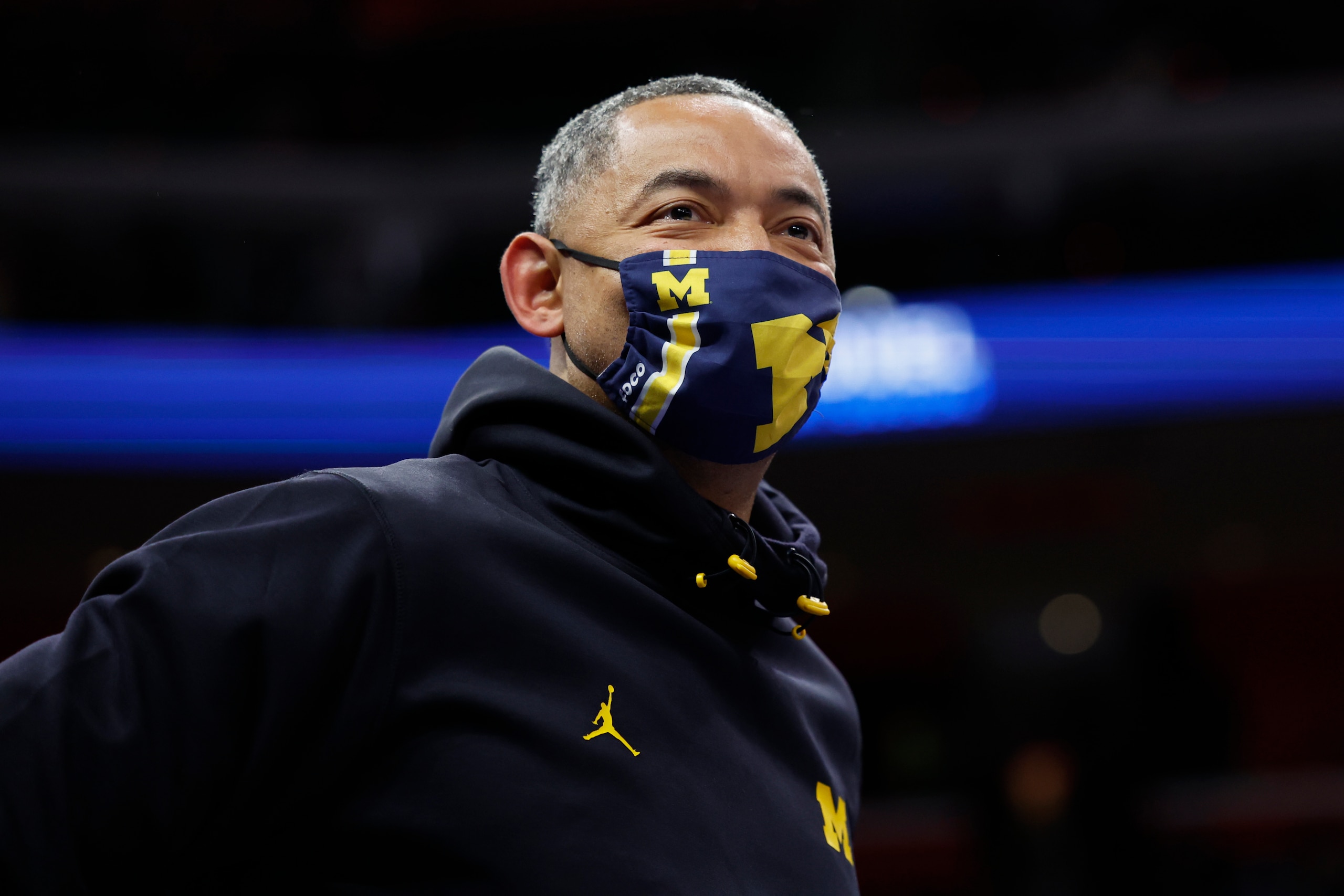 DETROIT, MICHIGAN - DECEMBER 19: Michigan head coach Juwan Howard watches the game between the Detroit Pistons and the Miami Heat at Little Caesars Arena on December 19, 2021 in Detroit, Michigan. NOTE TO USER: User expressly acknowledges and agrees that, by downloading and or using this photograph, User is consenting to the terms and conditions of the Getty Images License Agreement.  (Photo by Rick Osentoski/Getty Images)
