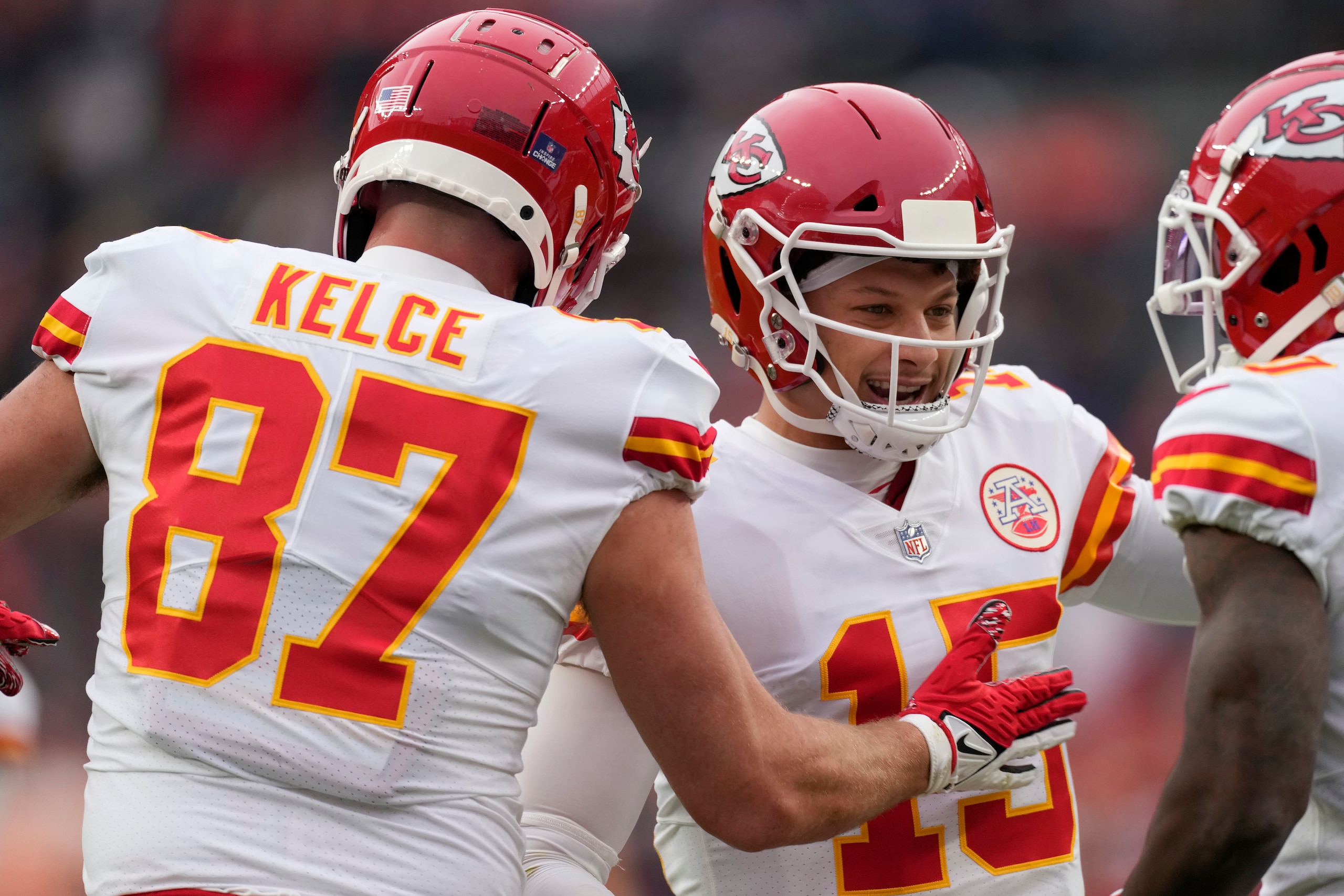 Kansas City Chiefs tight end Travis Kelce (87) celebrates after catching a touchdown pass from quarterback Patrick Mahomes (15) during the first half of an NFL football game against the Denver Broncos Saturday, Jan. 8, 2022, in Denver. (AP Photo/David Zalubowski) Kansas City Chiefs tight end Travis Kelce (87) celebrates after catching a touchdown pass from quarterback Patrick Mahomes (15) during the first half of an NFL football game against the Denver Broncos Saturday, Jan. 8, 2022, in Denver. (AP Photo/David Zalubowski)