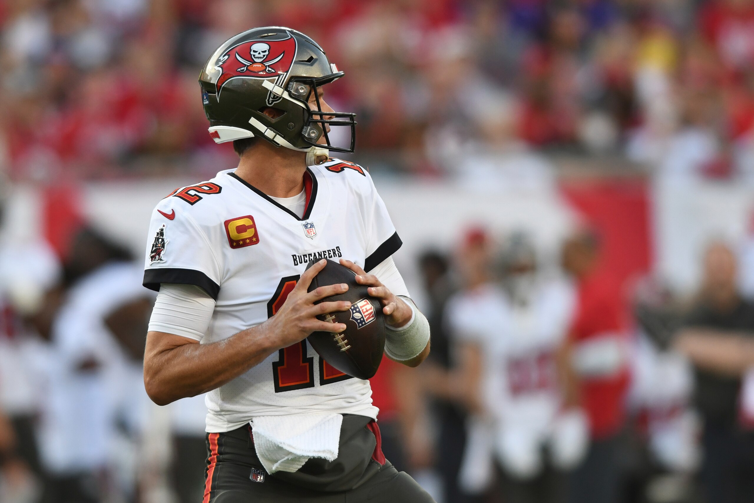 Tampa Bay Buccaneers quarterback Tom Brady (12) looks to pass against the Carolina Panthers during the first half of an NFL football game Sunday, Jan. 9, 2022, in Tampa, Fla. (AP Photo/Jason Behnken)