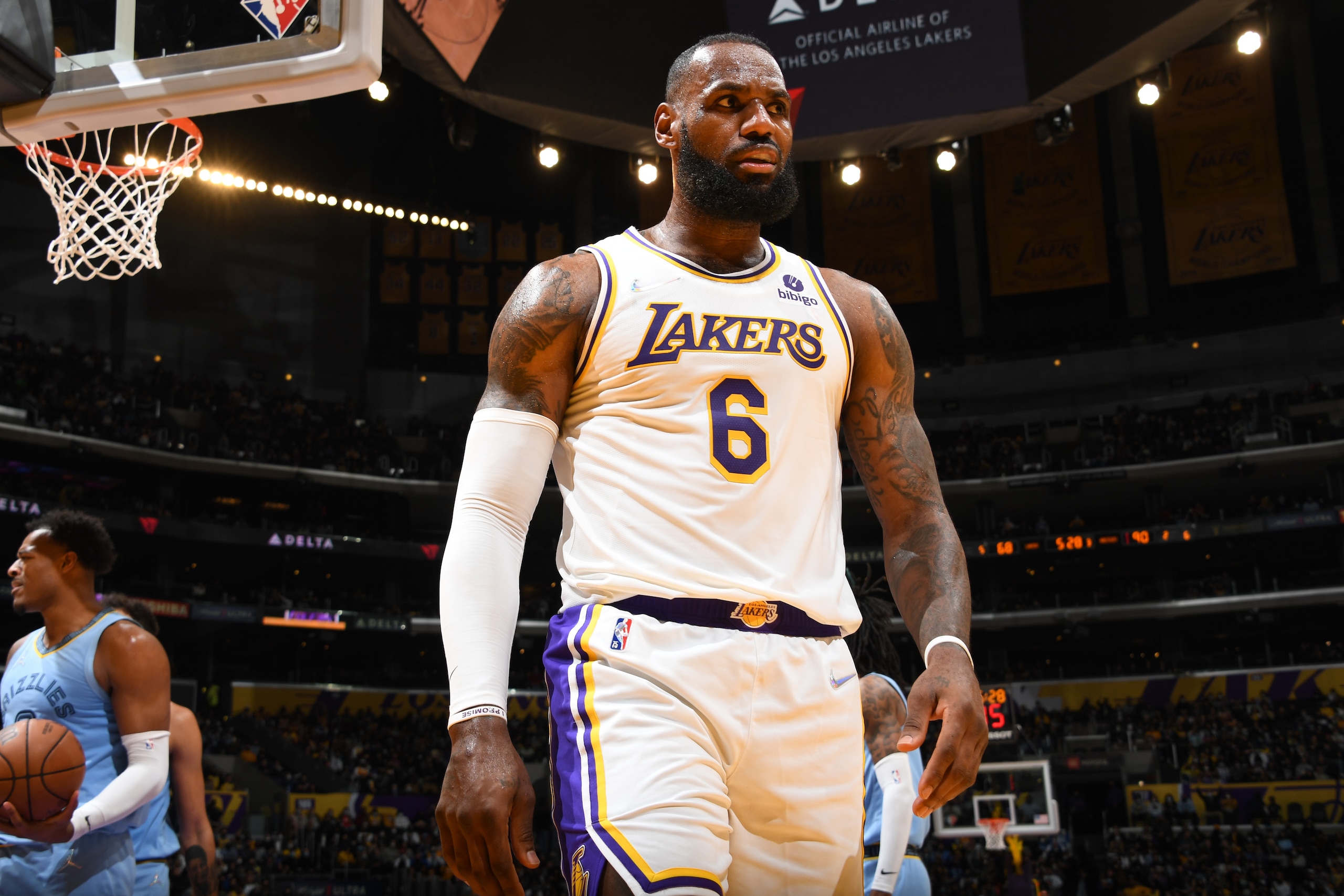 LOS ANGELES, CA - JANUARY 9: LeBron James #6 of the Los Angeles Lakers looks on during the game against the Memphis Grizzlies on January 9, 2022 at Crypto.Com Arena in Los Angeles, California. NOTE TO USER: User expressly acknowledges and agrees that, by downloading and/or using this Photograph, user is consenting to the terms and conditions of the Getty Images License Agreement. Mandatory Copyright Notice: Copyright 2021 NBAE (Photo by Andrew D. Bernstein/NBAE via Getty Images) LOS ANGELES, CA - JANUARY 9: LeBron James #6 of the Los Angeles Lakers looks on during the game against the Memphis Grizzlies on January 9, 2022 at Crypto.Com Arena in Los Angeles, California. NOTE TO USER: User expressly acknowledges and agrees that, by downloading and/or using this Photograph, user is consenting to the terms and conditions of the Getty Images License Agreement. Mandatory Copyright Notice: Copyright 2021 NBAE (Photo by Andrew D. Bernstein/NBAE via Getty Images)