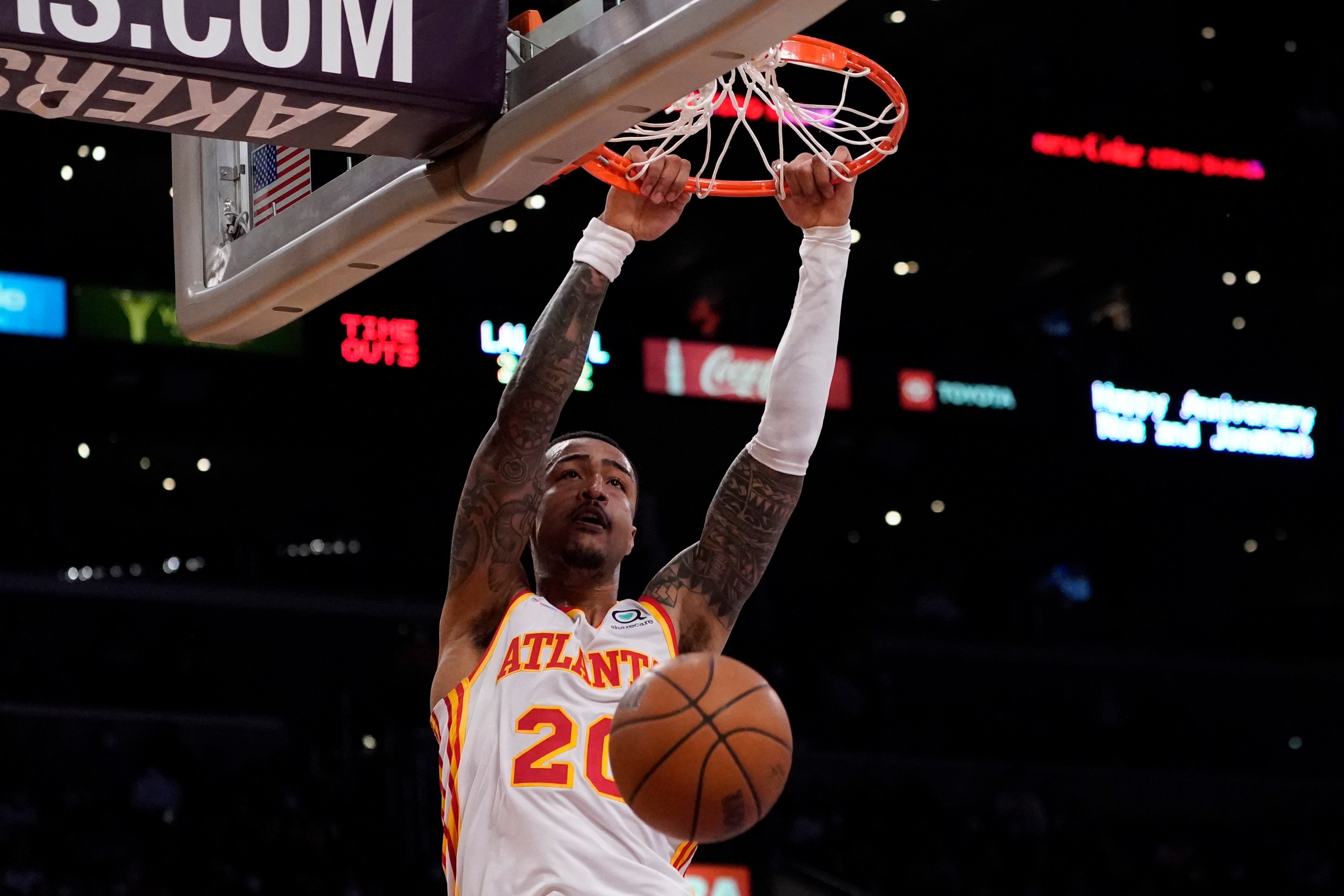 Atlanta Hawks forward John Collins (20) dunks during the second half of an NBA basketball game against the Los Angeles Lakers in Los Angeles, Friday, Jan. 7, 2022. (AP Photo/Ashley Landis)