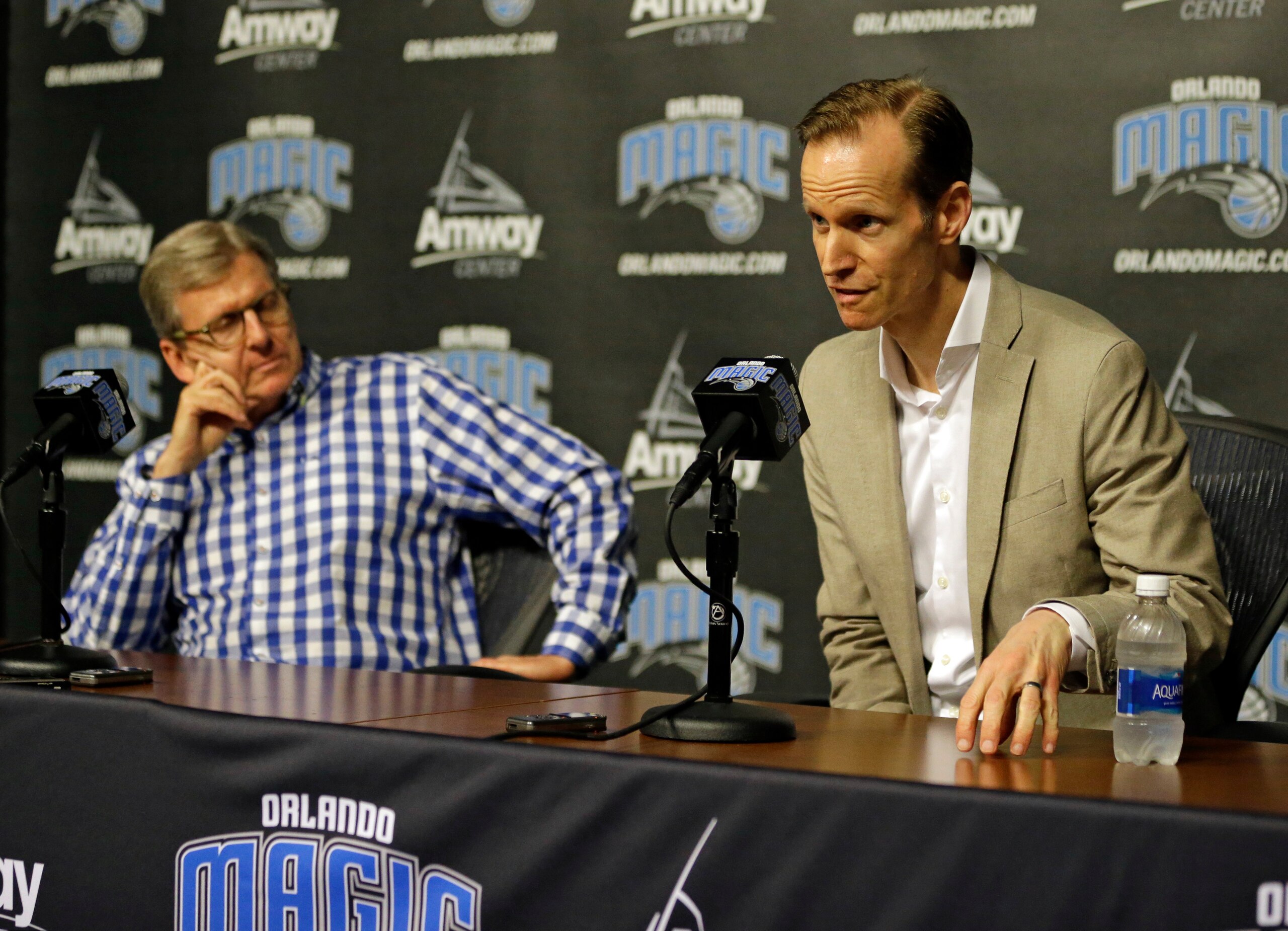 Orlando Magic general manager John Hammond, left, listens as president of basketball operations Jeff Weltman talks about the upcoming NBA basketball draft during a news conference, Monday, June 19, 2017, in Orlando, Fla. Orlando Magic have the sixth, 25th, 33rd and 35th picks in the 2017 draft. (AP Photo/John Raoux)