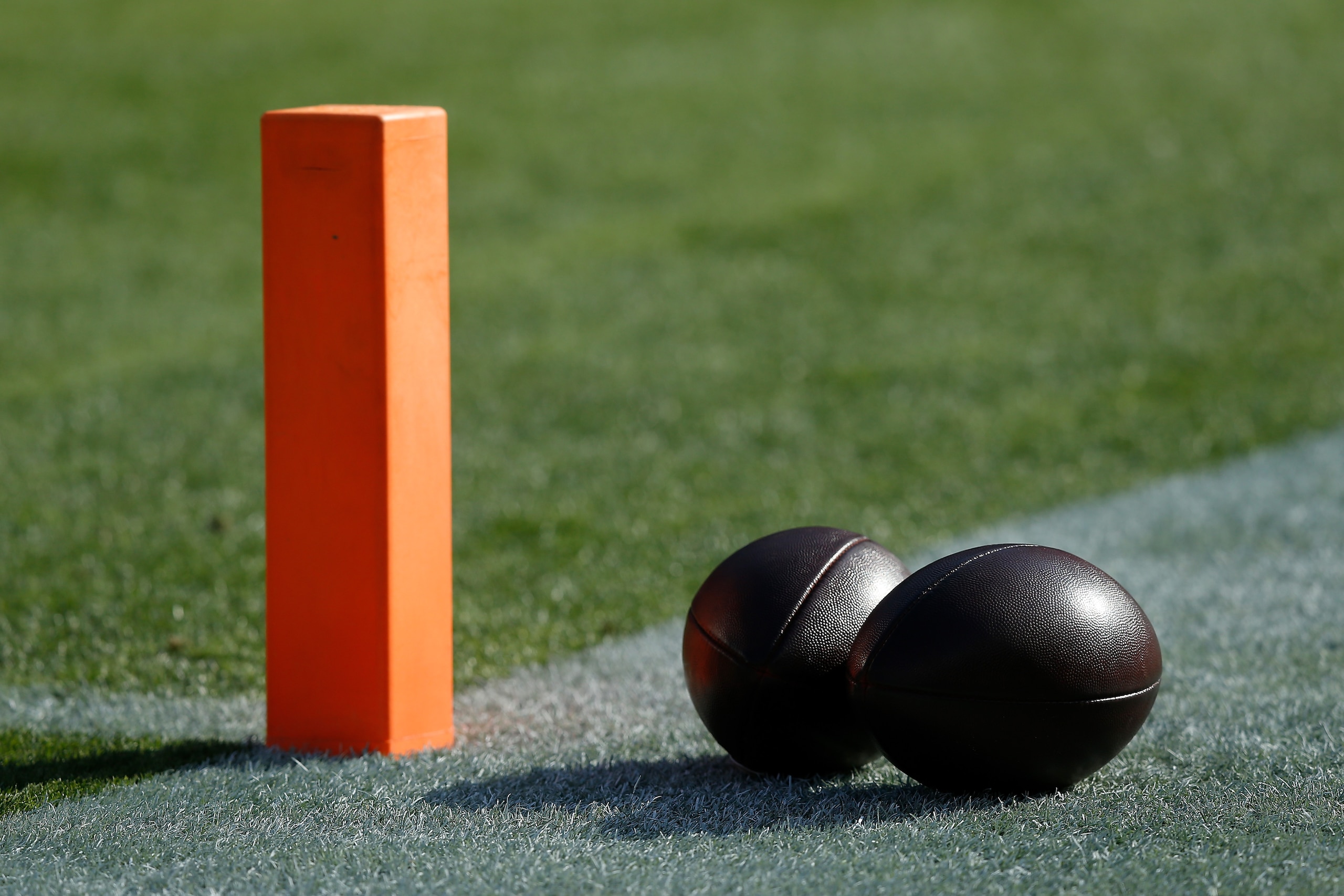 SANTA CLARA, CALIFORNIA - DECEMBER 19: Footballs sit on the field before the game between the Atlanta Falcons and the San Francisco 49ers at Levi's Stadium on December 19, 2021 in Santa Clara, California. (Photo by Lachlan Cunningham/Getty Images)