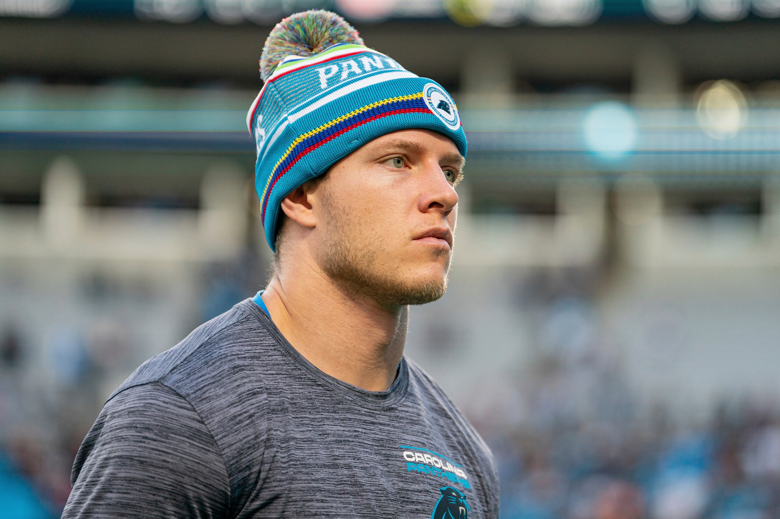 Carolina Panthers running back Christian McCaffrey walks off the field after a loss to the Tampa Bay Buccaneers after an NFL football game Sunday, Dec. 26, 2021, in Charlotte, N.C. (AP Photo/Jacob Kupferman)