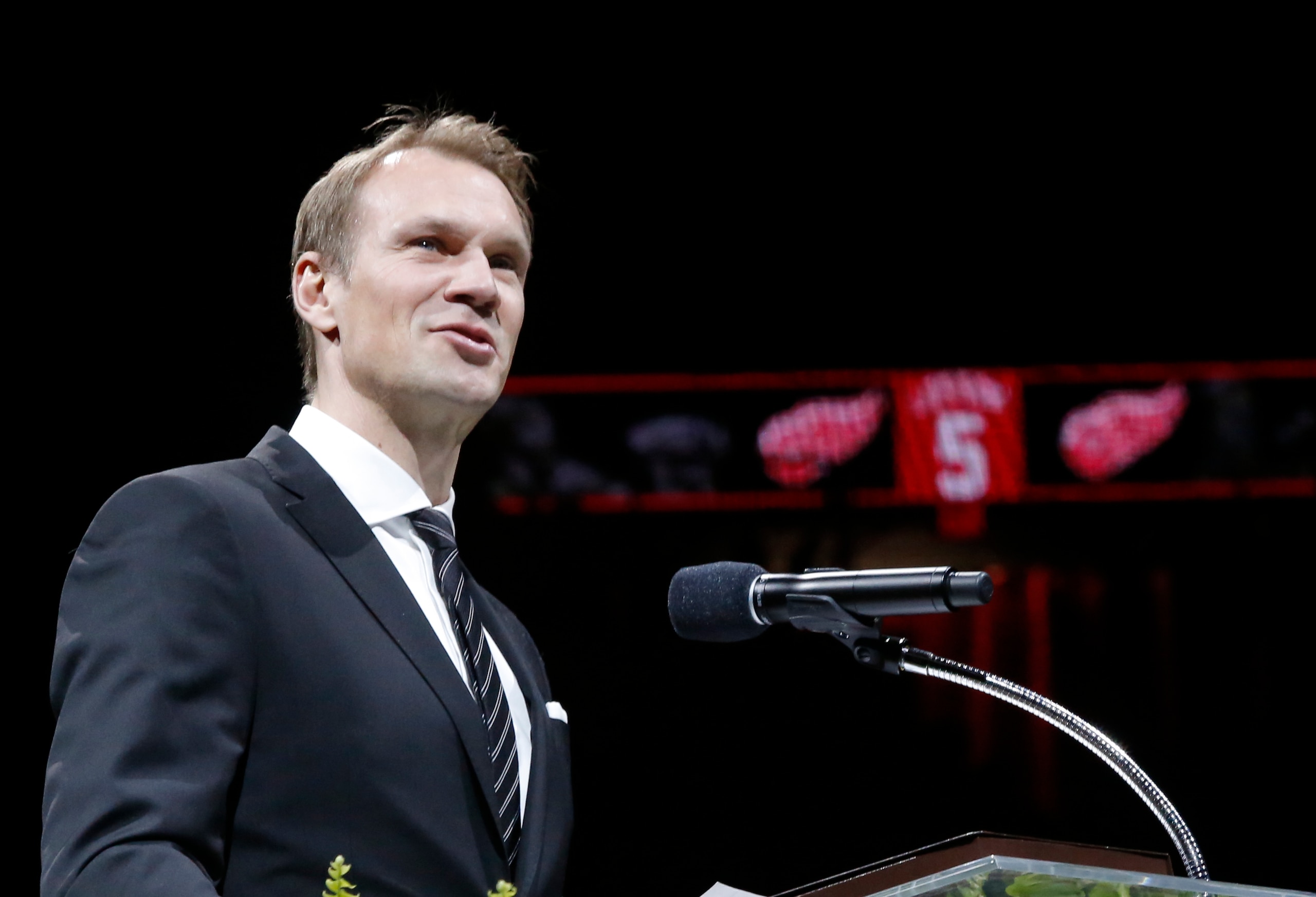 Former Detroit Red Wing Nicklas Lidstrom addresses the audience during the retirement of his No. 5 during a ceremony before an NHL hockey game between the Detroit Red Wings and Colorado Avalanche at Joe Louis Arena, Thursday, March 6, 2014, in Detroit. (AP Photo/Duane Burleson)