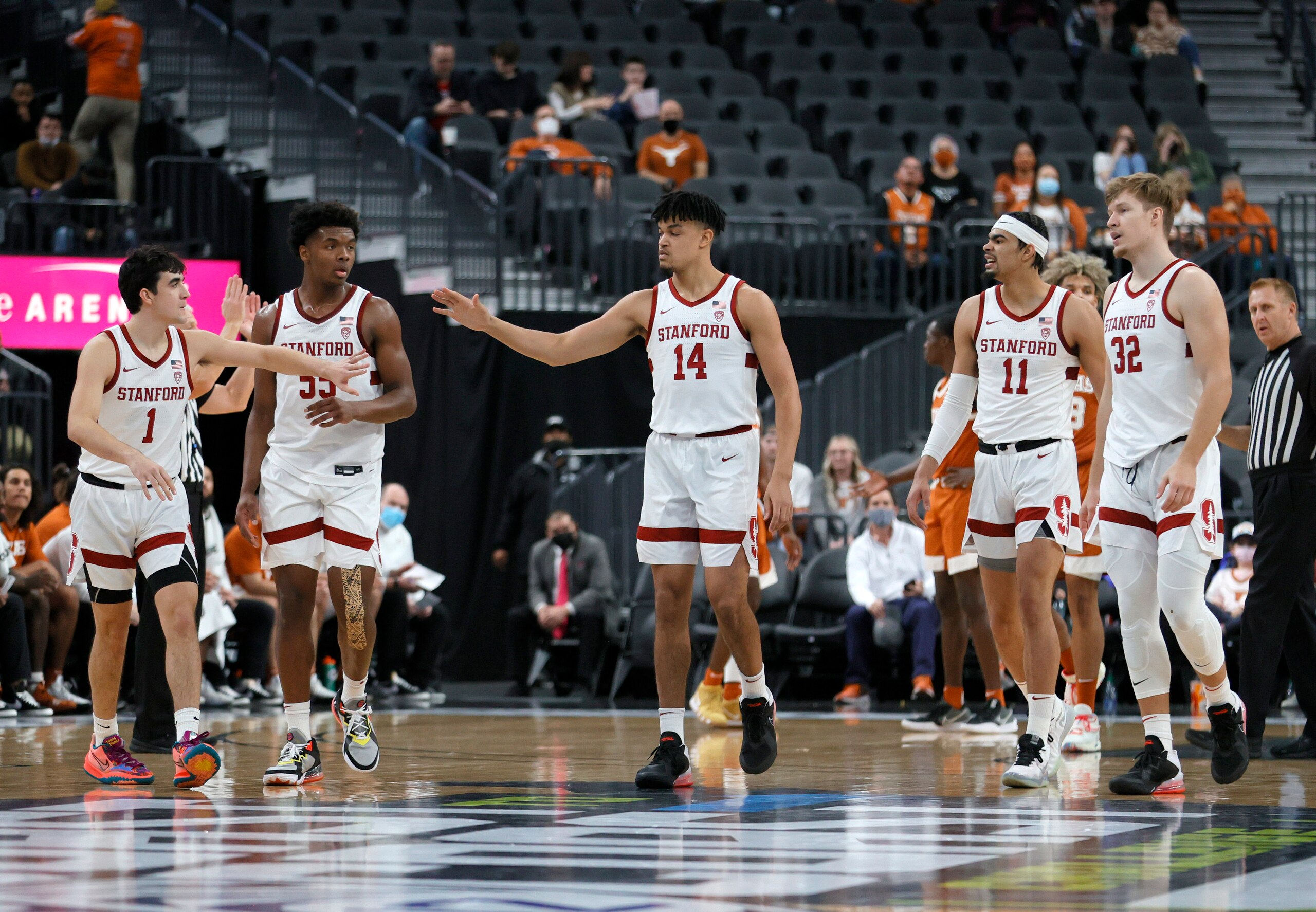 LAS VEGAS, NEVADA - DECEMBER 19:  Isael Silva #1, Harrison Ingram #55, Spencer Jones #14, Jaiden Delaire #11 and Lukas Kisunas #32 of the Stanford Cardinal walk on the court after a timeout during the Pac-12 Coast-to-Coast Challenge against the Texas Longhorns at T-Mobile Arena on December 19, 2021 in Las Vegas, Nevada. The Longhorns defeated the Cardinal 60-53.  (Photo by Ethan Miller/Getty Images)