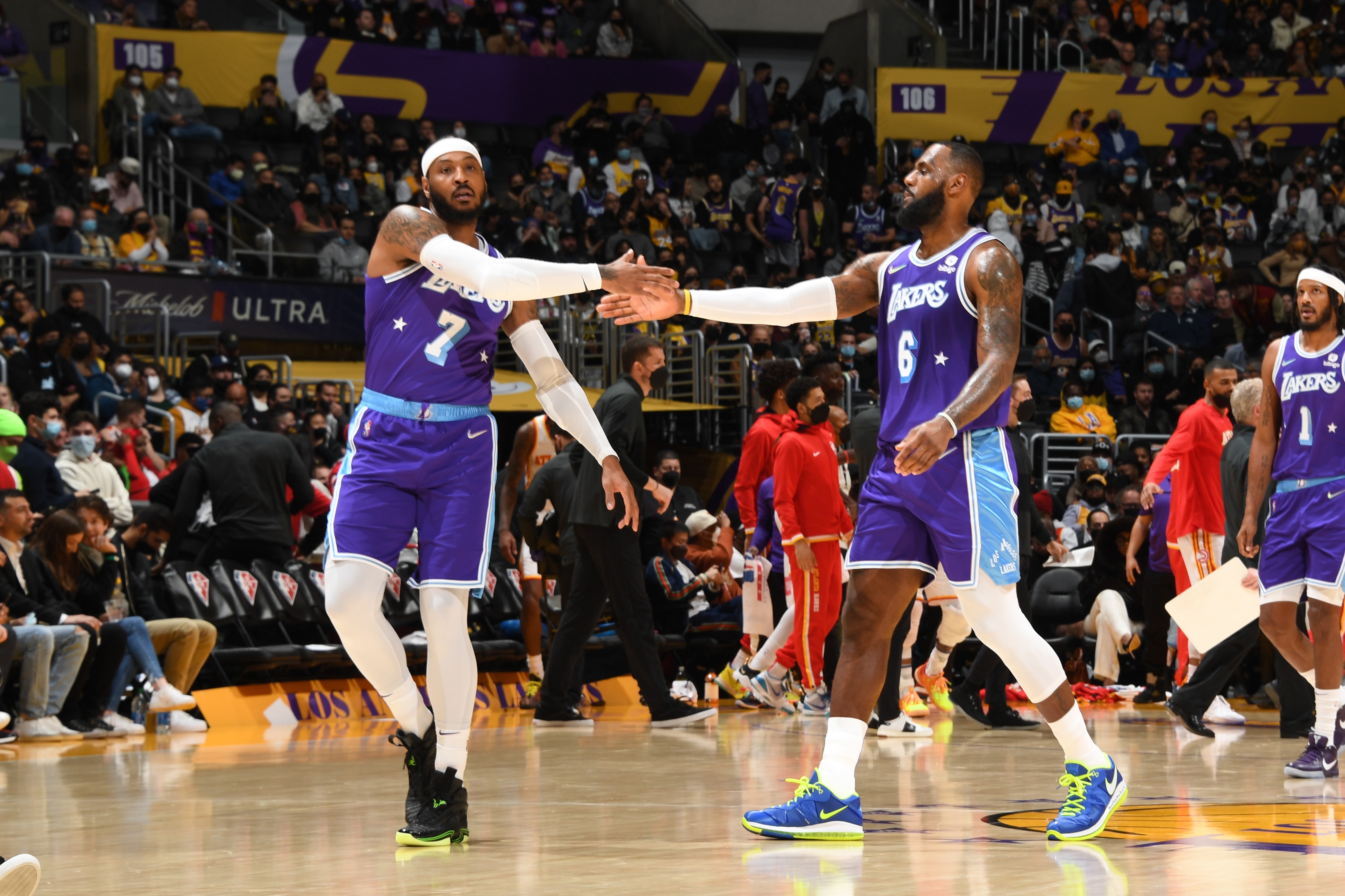 LOS ANGELES, CA - JANUARY 7: LeBron James #6 hi-fives Carmelo Anthony #7 of the Los Angeles Lakers during the game against the Atlanta Hawks on January 7, 2022 at Crypto.Com Arena in Los Angeles, California. NOTE TO USER: User expressly acknowledges and agrees that, by downloading and/or using this Photograph, user is consenting to the terms and conditions of the Getty Images License Agreement. Mandatory Copyright Notice: Copyright 2021 NBAE (Photo by Andrew D. Bernstein/NBAE via Getty Images)