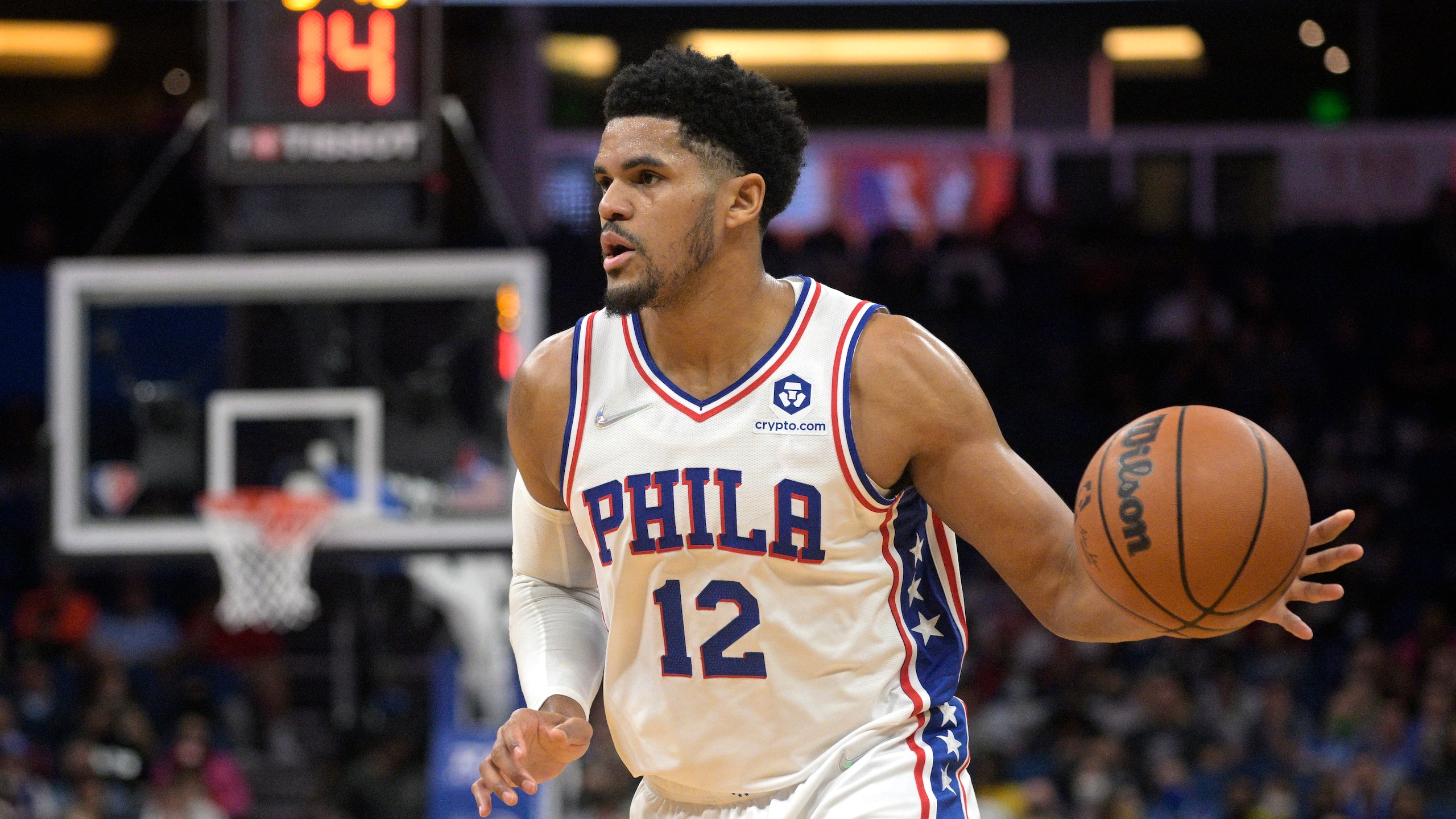 Philadelphia 76ers forward Tobias Harris (12) sets up a play during the first half of an NBA basketball game against the Orlando Magic, Wednesday, Jan. 5, 2022, in Orlando, Fla. (AP Photo/Phelan M. Ebenhack)