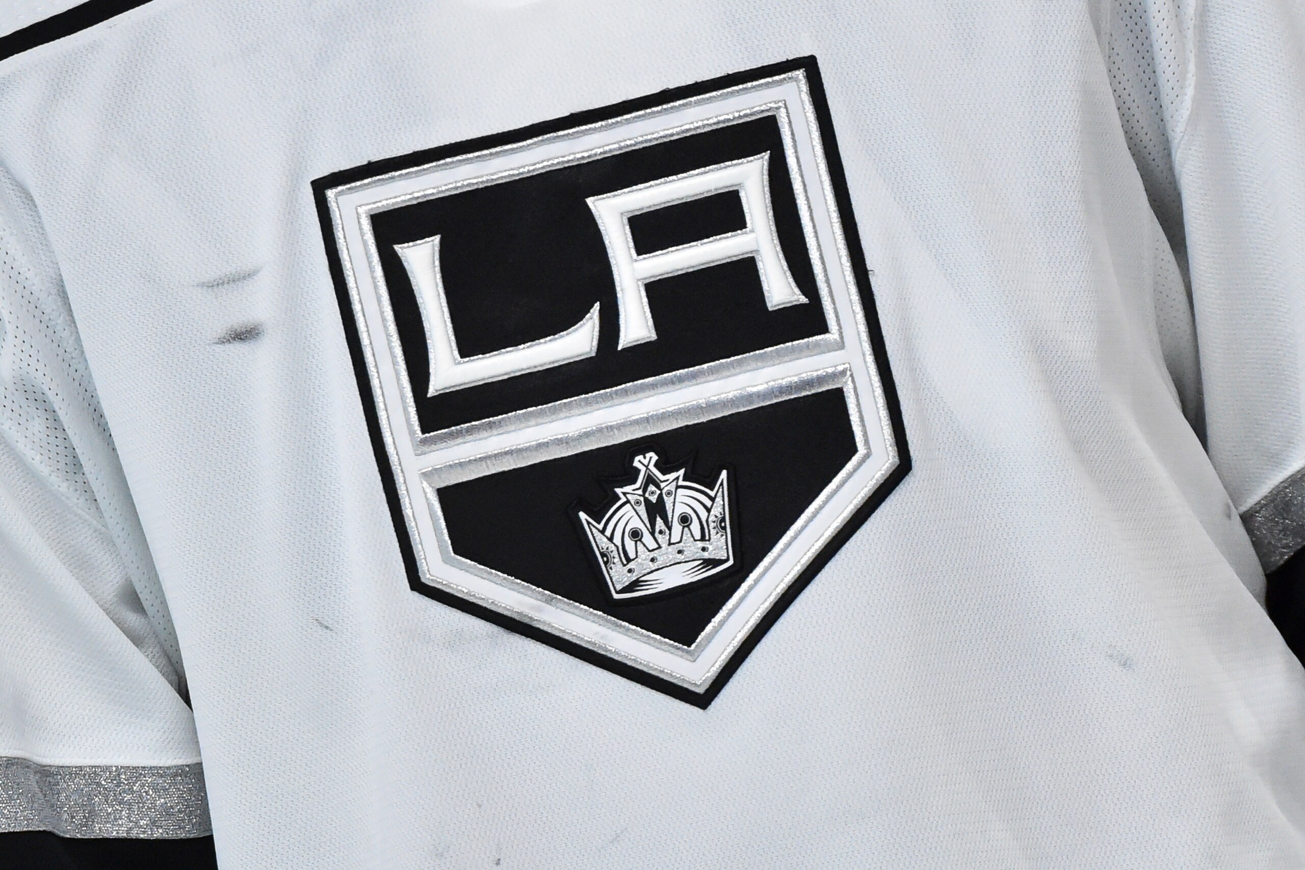 MONTREAL, QC - NOVEMBER 09:  A detailed view of the Los Angeles Kings logo seen during the second period against the Montreal Canadiens at Centre Bell on November 9, 2021 in Montreal, Canada.  The Los Angeles Kings defeated the Montreal Canadiens 3-2 in overtime.  (Photo by Minas Panagiotakis/Getty Images)