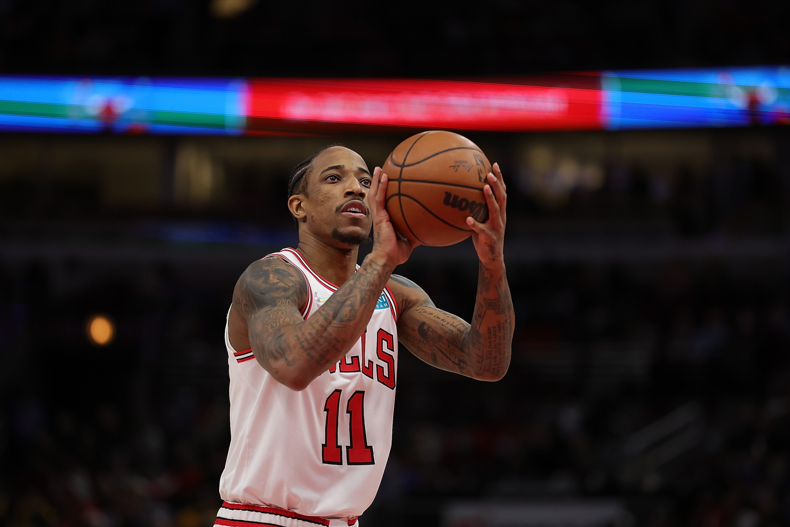 CHICAGO, ILLINOIS - JANUARY 14: DeMar DeRozan #11 of the Chicago Bulls shoots a free throw during a game against the Golden State Warriors at United Center on January 14, 2022 in Chicago, Illinois. NOTE TO USER: User expressly acknowledges and agrees that, by downloading and or using this photograph, User is consenting to the terms and conditions of the Getty Images License Agreement. (Photo by Stacy Revere/Getty Images)