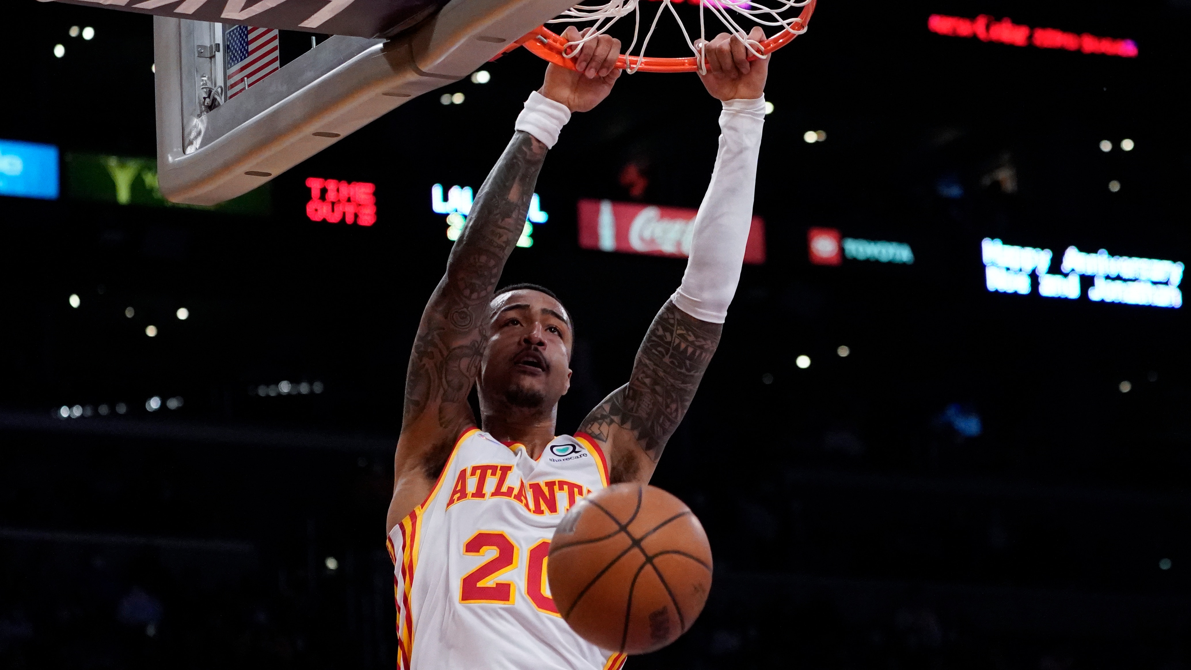 Atlanta Hawks forward John Collins (20) dunks during an NBA basketball game against the Los Angeles Lakers in Los Angeles, Friday, Jan. 7, 2022. (AP Photo/Ashley Landis)