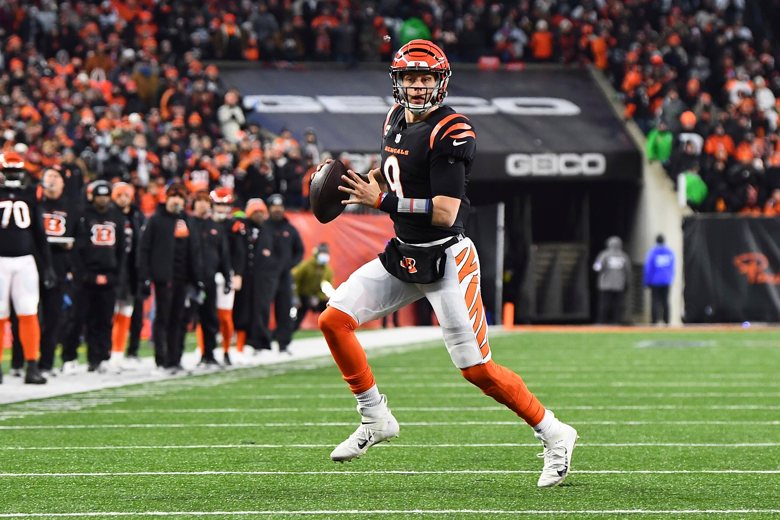 Cincinnati Bengals quarterback Joe Burrow (9) looks to pass in the first half during an NFL wild-card playoff football game against the Las Vegas Raiders, Saturday, Jan. 15, 2022, in Cincinnati. (AP Photo/Emilee Chinn)
