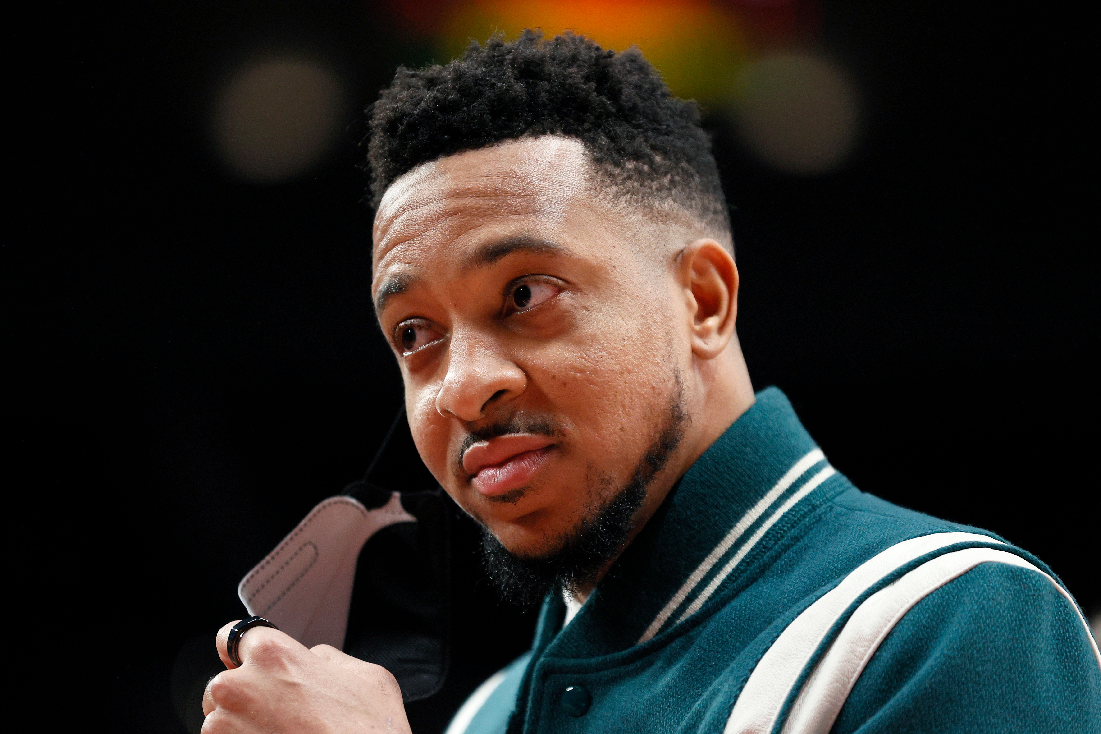 PORTLAND, OREGON - DECEMBER 15: CJ McCollum #3 of the Portland Trail Blazers looks on during the second quarter against the Memphis Grizzlies at Moda Center on December 15, 2021 in Portland, Oregon. NOTE TO USER: User expressly acknowledges and agrees that, by downloading and or using this photograph, User is consenting to the terms and conditions of the Getty Images License Agreement. (Photo by Steph Chambers/Getty Images)