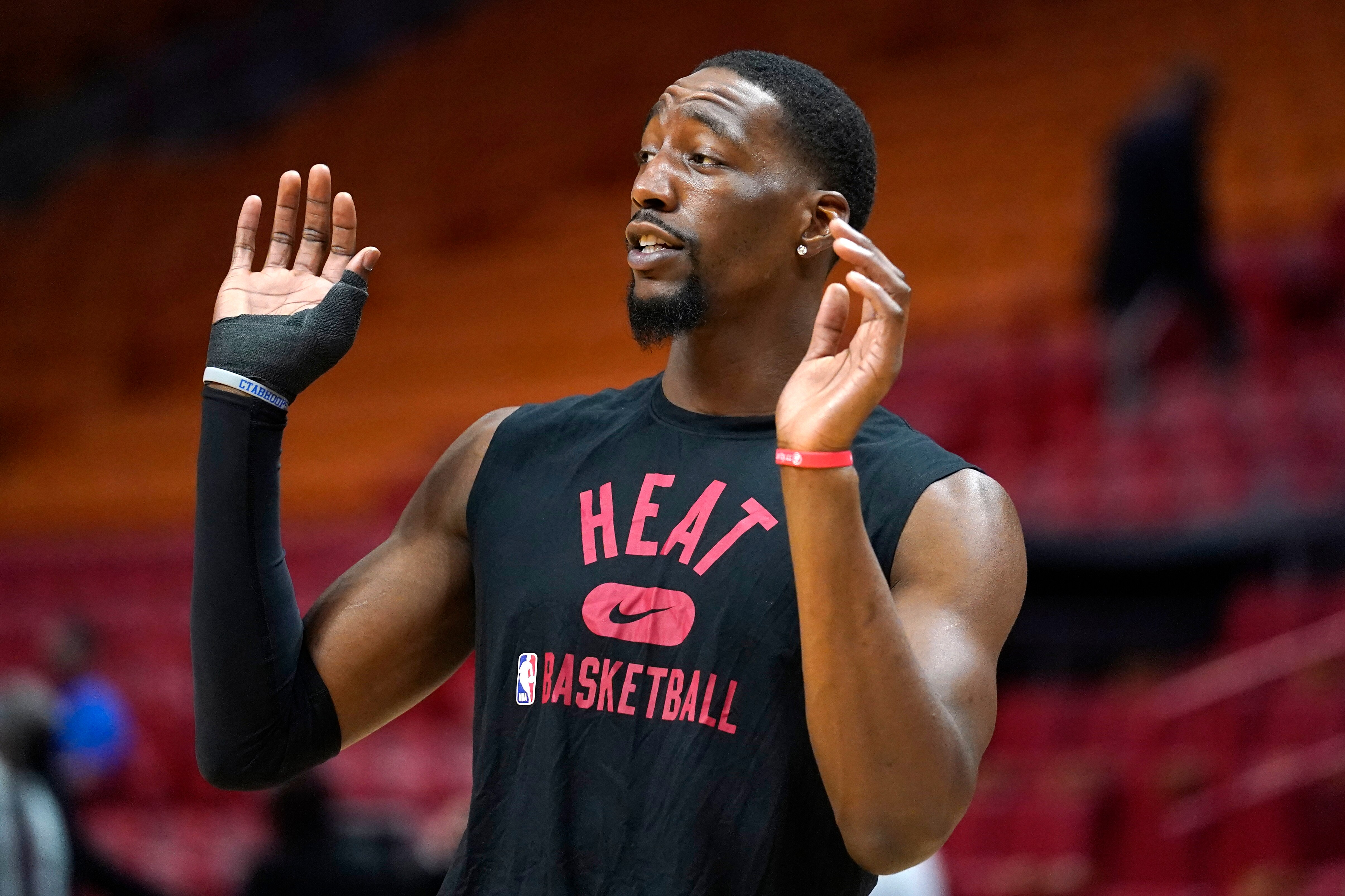 Miami Heat center Bam Adebayo warms up before an NBA basketball game against the Atlanta Hawks, Friday, Jan. 14, 2022, in Miami. Adebayo has been out of the lineup since undergoing right thumb surgery in December 2021. (AP Photo/Lynne Sladky)
